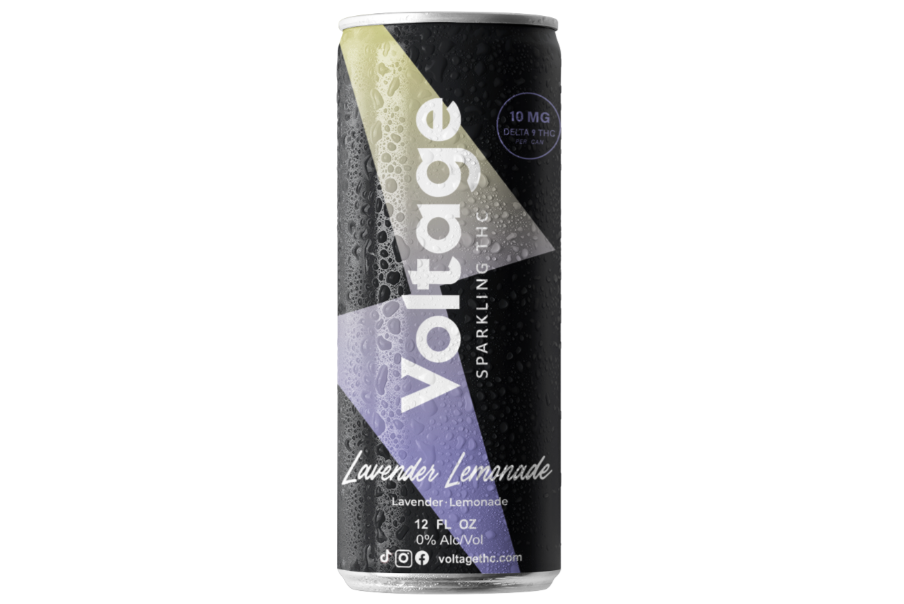 A 12-ounce can of Voltage Sparkling tea in lavender lemonade flavor with water droplets on the surface, black background, and white and purple text.