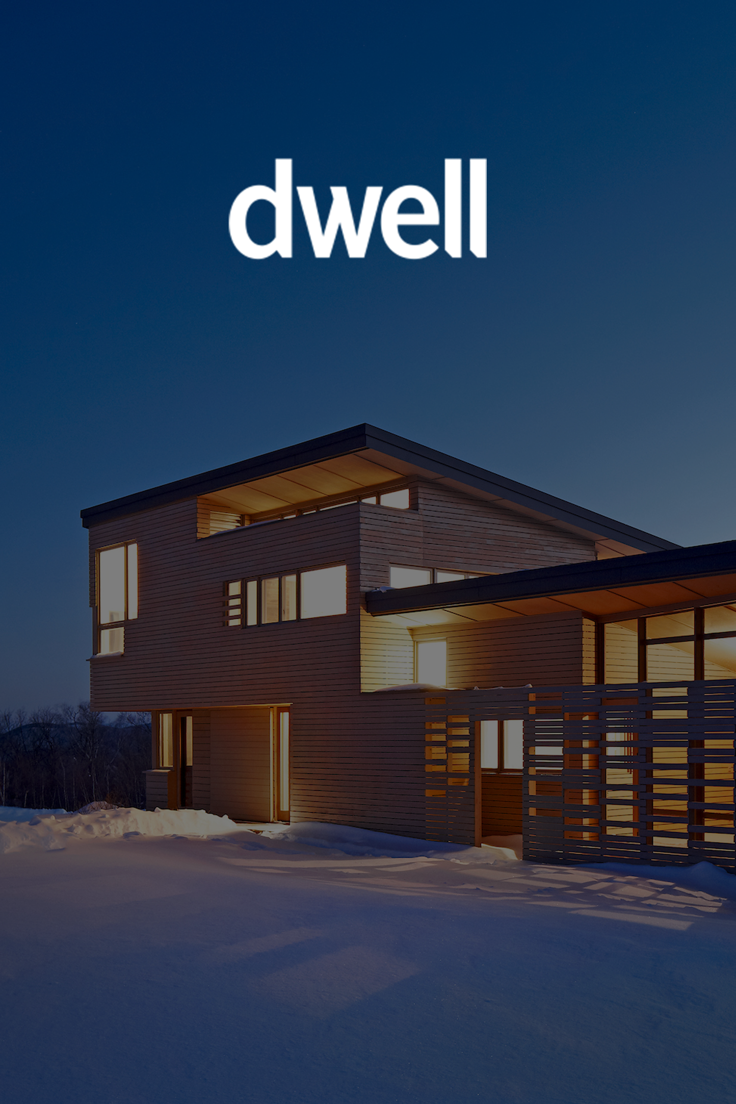 Cover photo of Dwell magazine featuring modern house illuminated at dusk with snow on the ground.