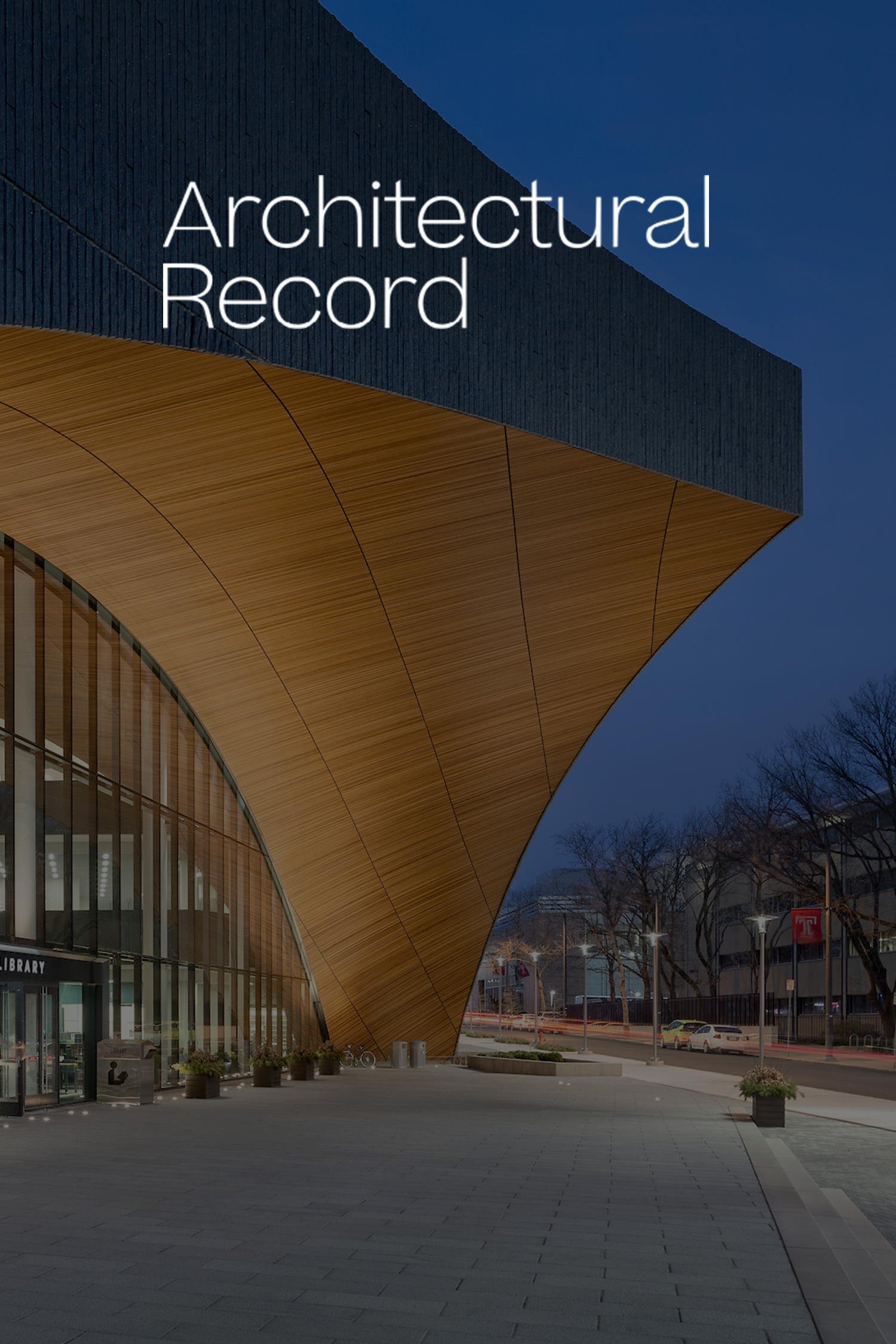 Cover photo of Architectural Record magazine featuring modern architecture building with arched wooden entryway and dark exterior panels, a city street with parked cars and streetlights in the background at dusk.