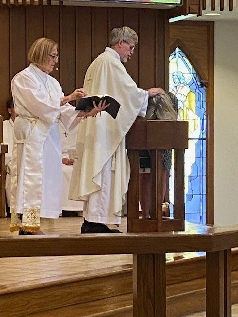 Joanne Scane, a resident of Southern England and the niece of parishioner Pauline Brown, wanted to be baptized into Grace Church, which was done Sunday, April 26, by Fr. Gary with the assistance of Deacon Jonnette.