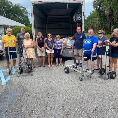 Got a good crew from Grace Church and the Daytona Drive-In Christian Church for unloading the truck of food supplies Saturday (May 9) from the Postal workers food drive. The food drive will help stock up the Grace Episcopal Church Food Pantry, which 