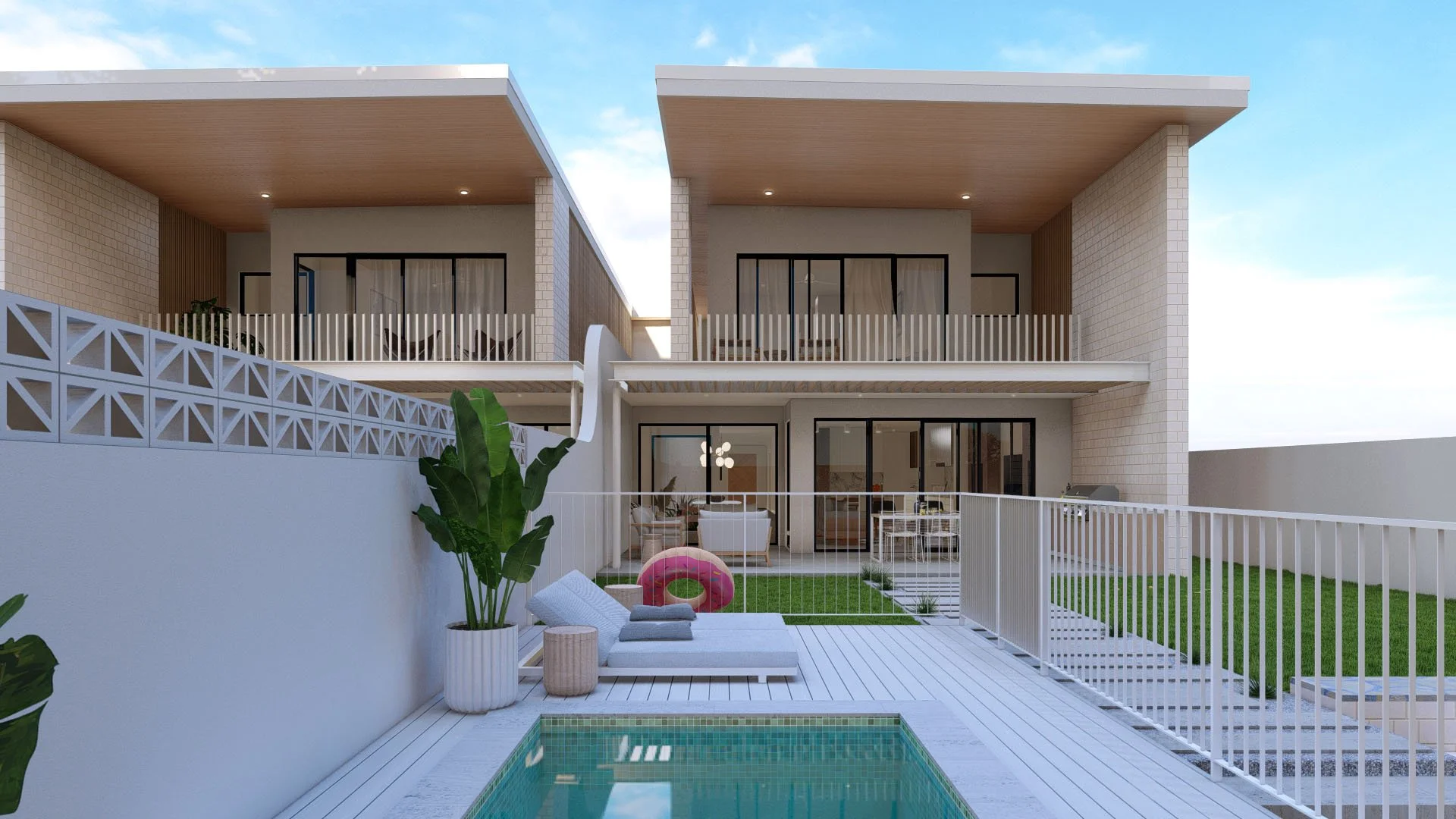 Modern two-story house with outdoor patio, small pool, green lawn, lounge chairs, pink pool float, and potted plants.