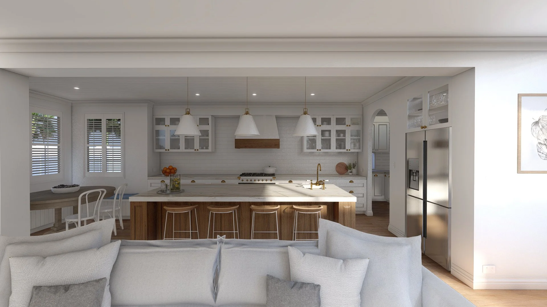 Modern kitchen with white cabinetry, a wooden island with bar stools, pendant lights, stainless steel refrigerator, and a dining area with a round table and white chairs.