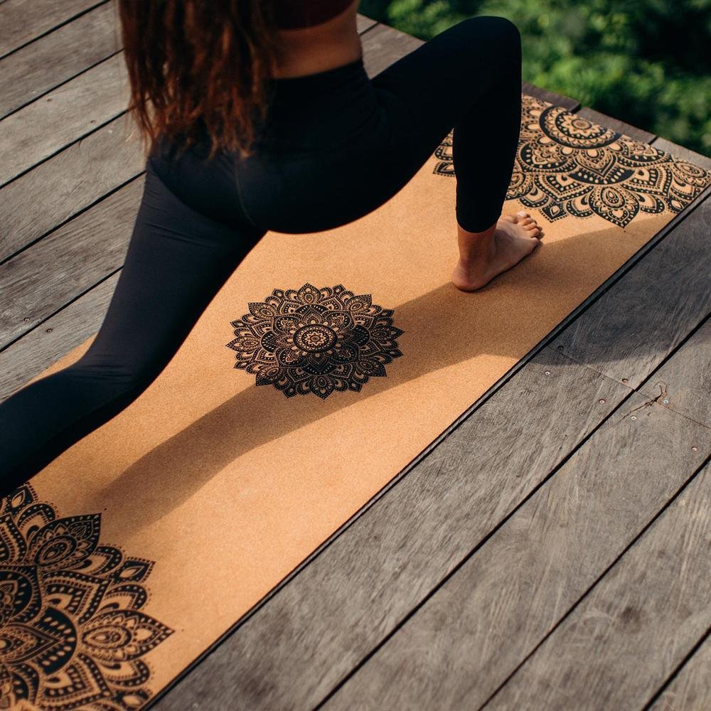 Woman doing yoga pose on Cork Yoga Mat