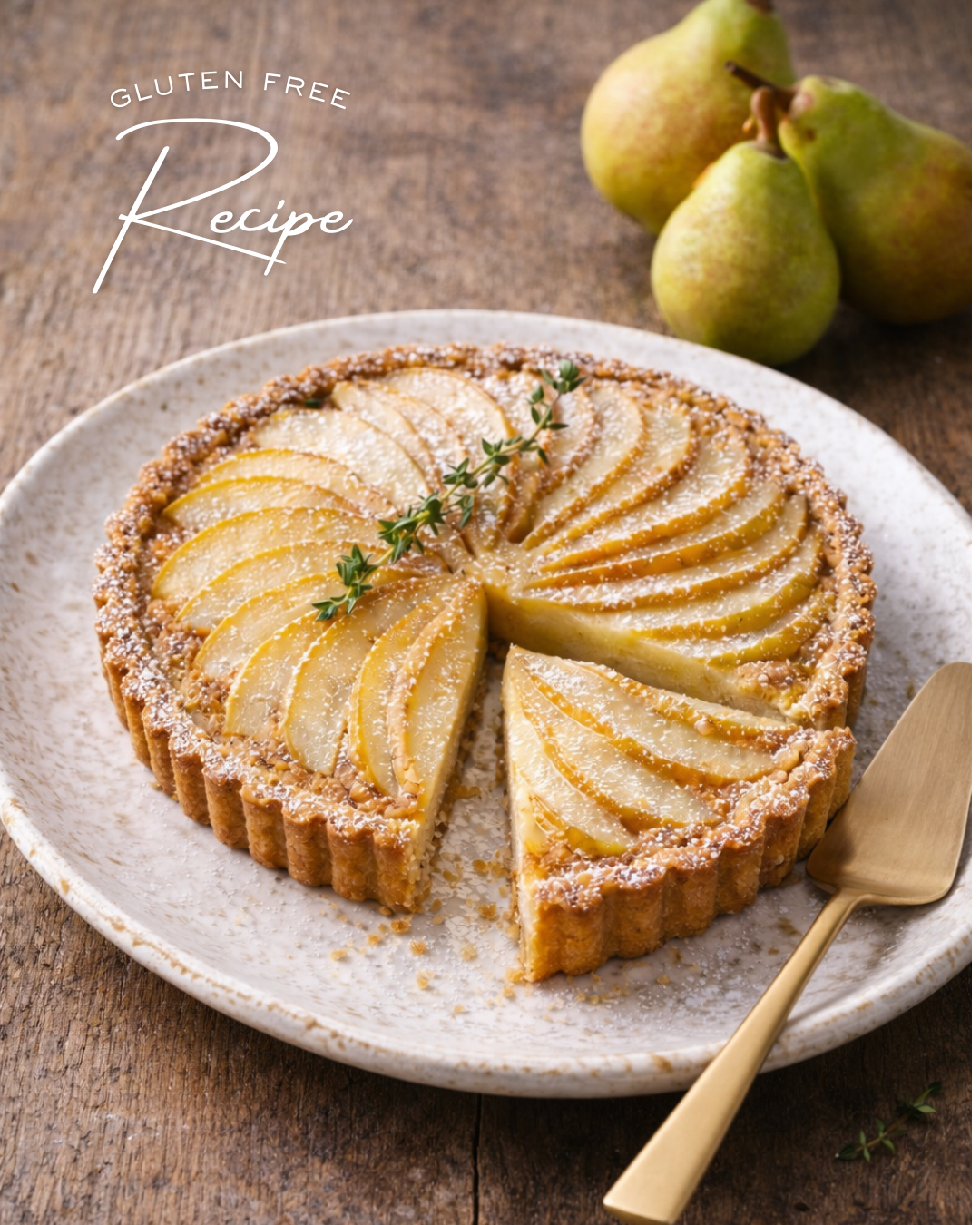 Pear tart on a white plate with sliced pears on top, garnished with a sprig of thyme, and a gold serving utensil. In the background, three fresh pears and text reading 'Gluten Free Recipe.'