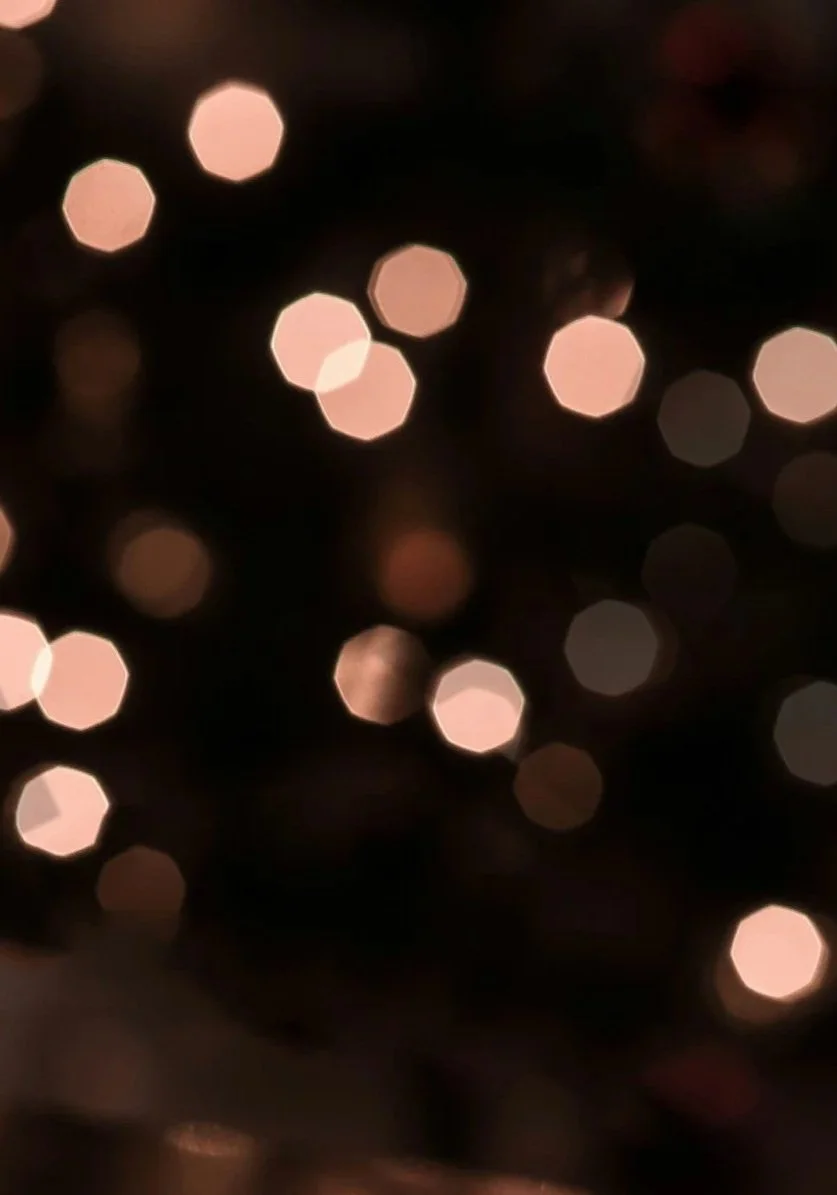 Out-of-focus lights creating a bokeh effect against a dark background.
