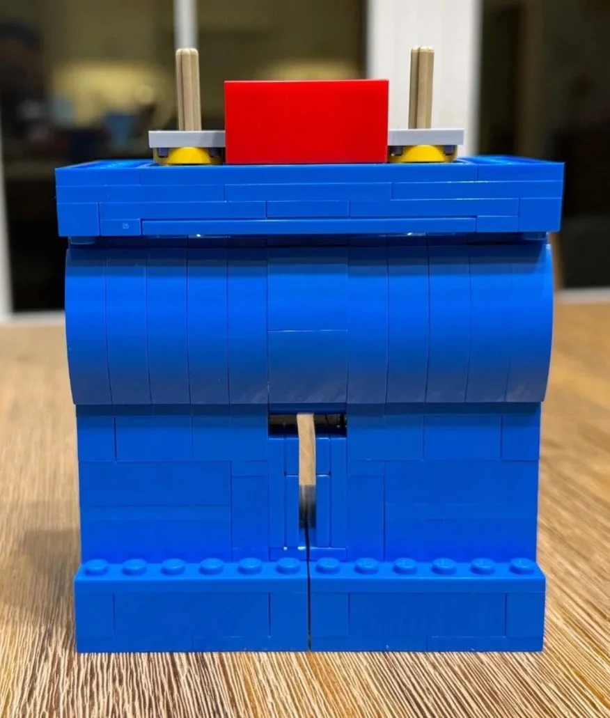 Completed blue lower body of LEGO Up-Scaled Red, showing both legs, the gap between them, and the hip platform.