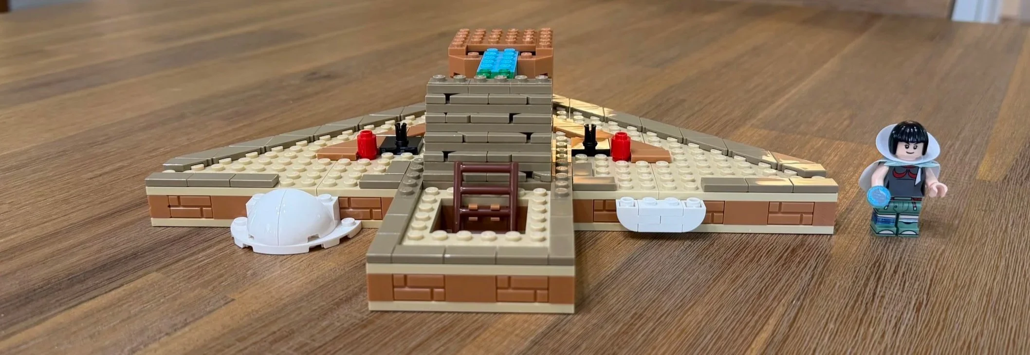 Partially built Sky Pillar stairs and raised platform on the tan Rayquaza display base.