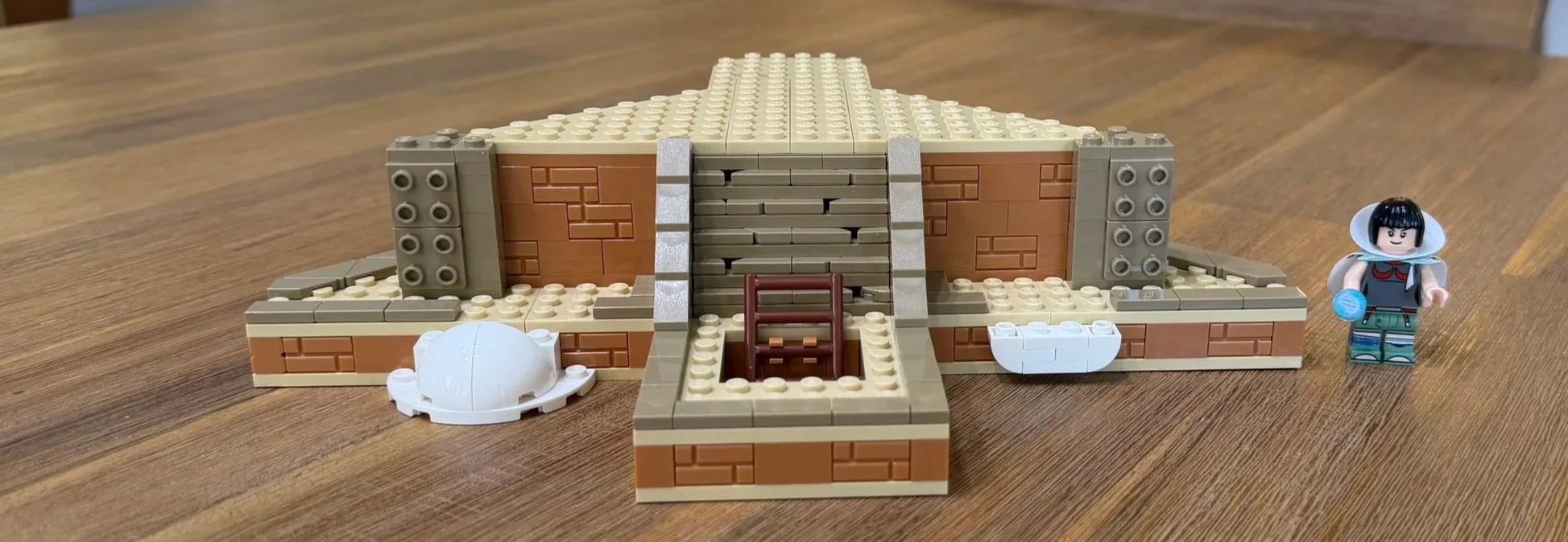 Rayquaza display platform with tan stairs, diagonal brown walls, and unfinished pillar connections.