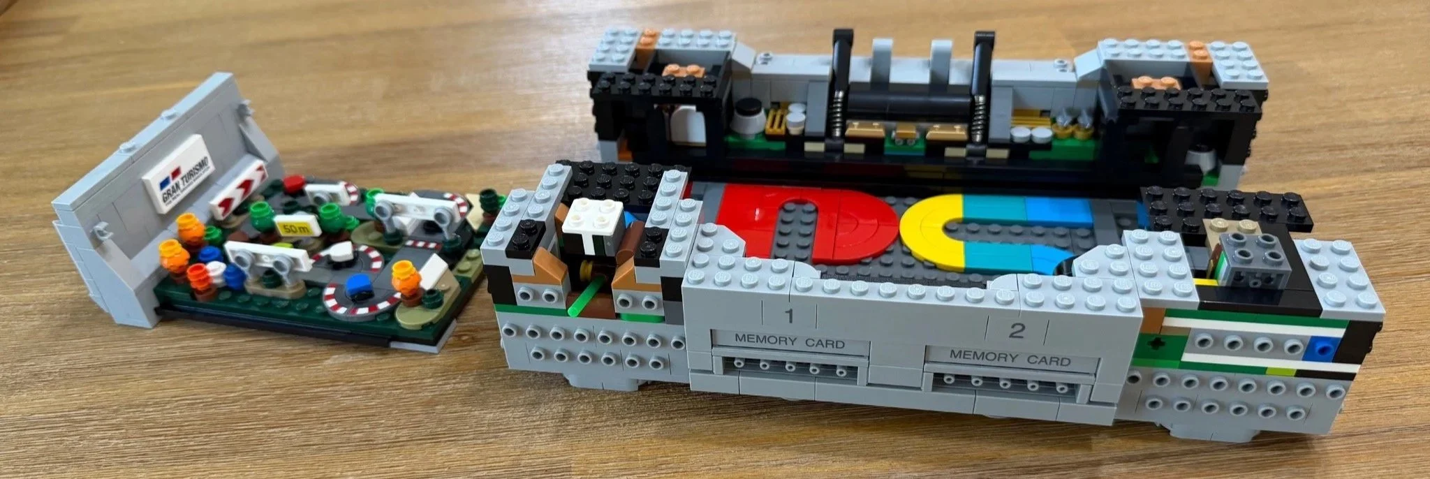 Unfinished LEGO PlayStation shell with its Power and Open mechanism areas and printed controller-port numbers.