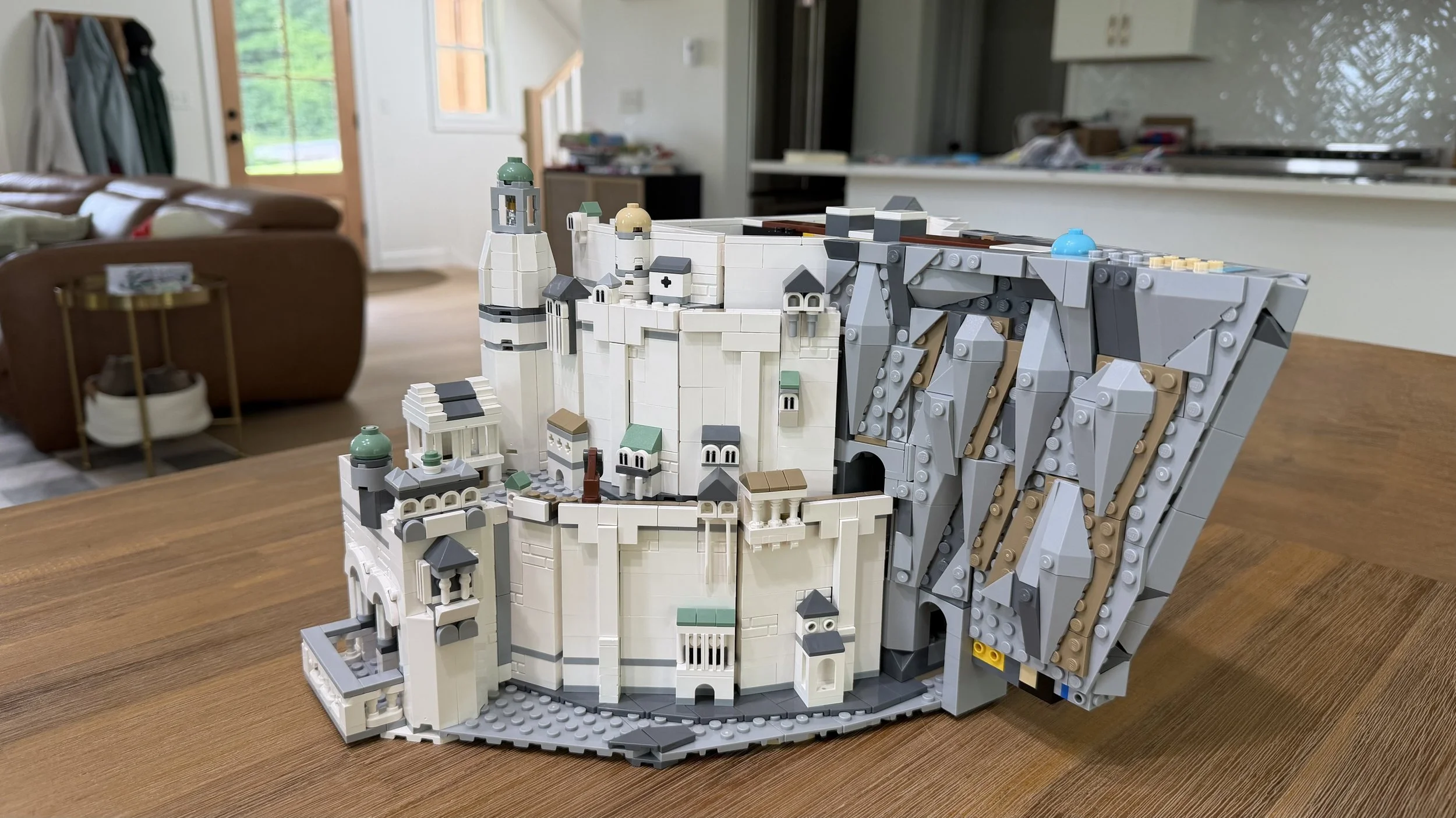 Partially disassembled LEGO model organized for rebuilding