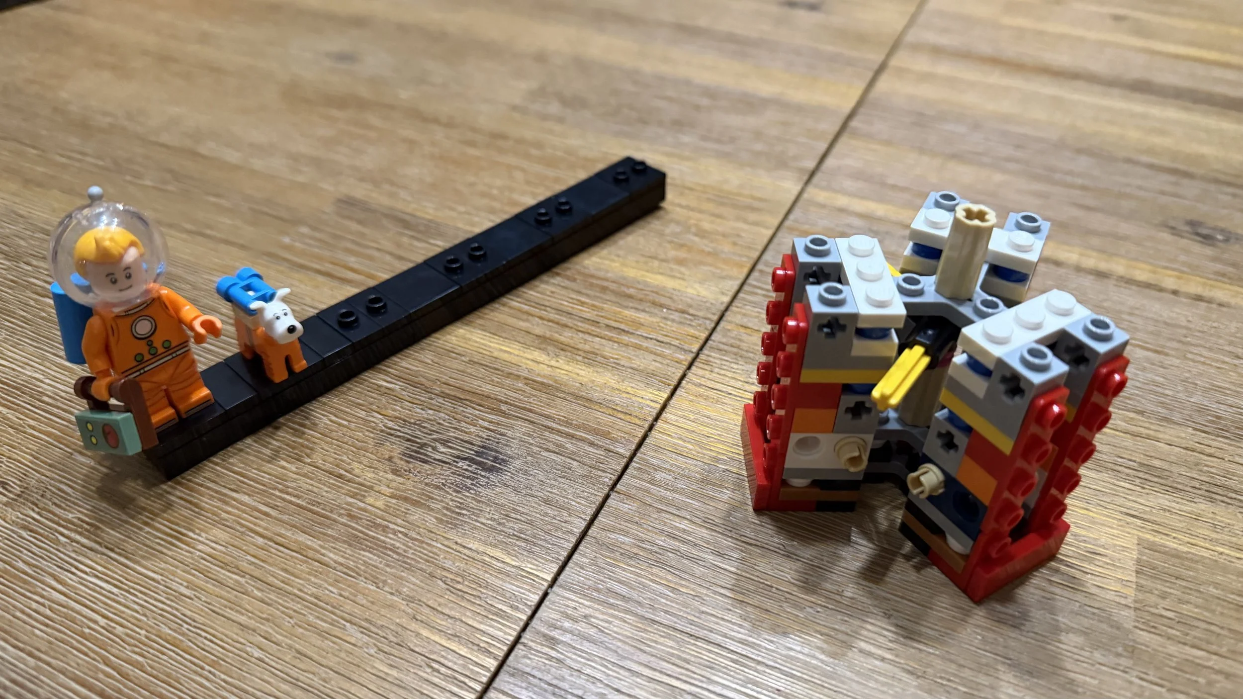 LEGO Tintin Moon Rocket character display and early rocket structure during Bag 1
