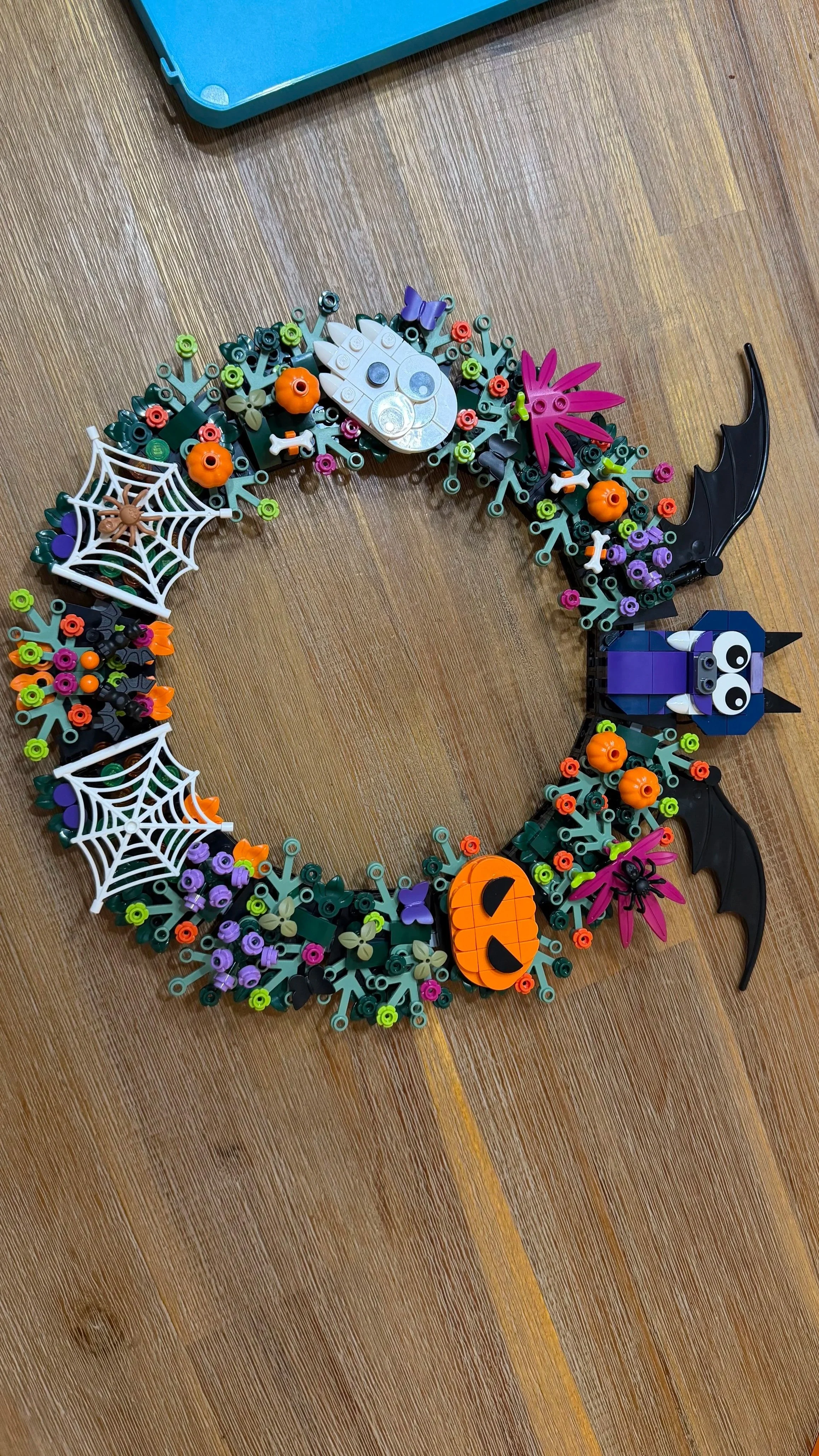 Completed LEGO Halloween Wreath 40825 with Halloween decorations and large bat
