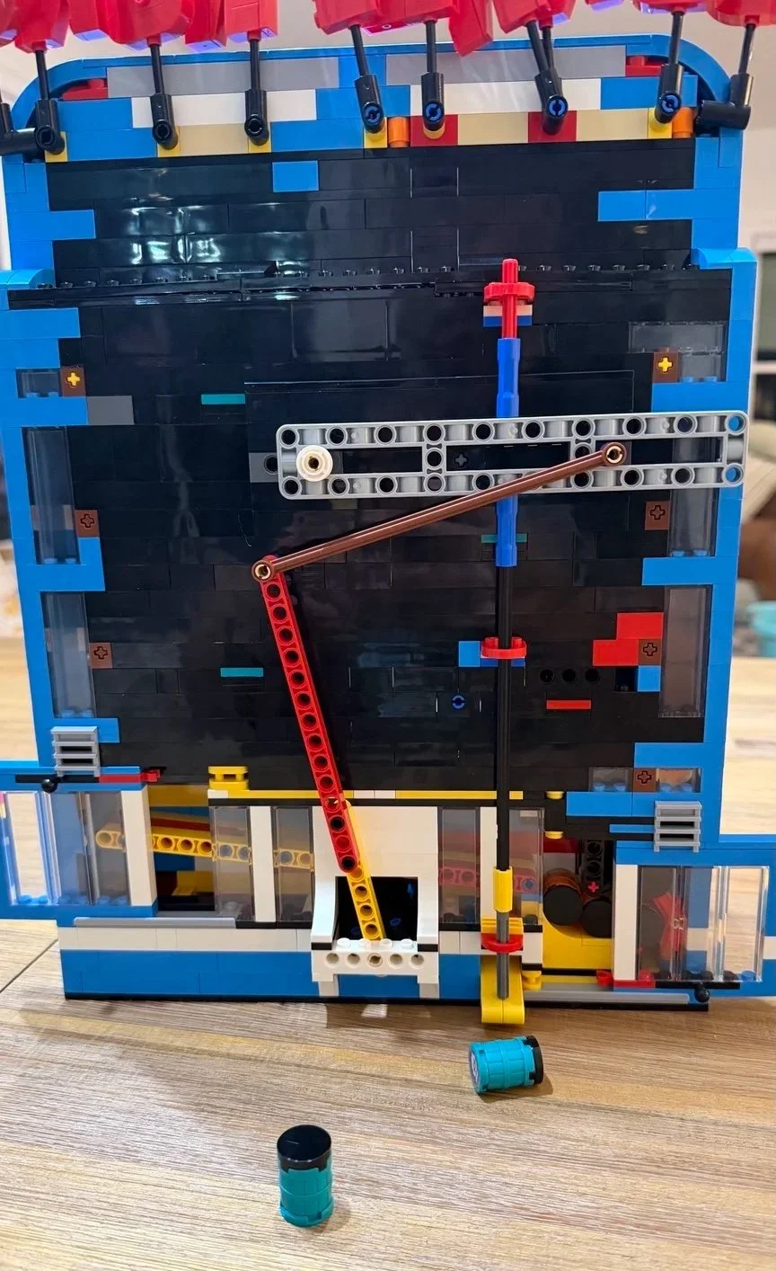 Rear of LEGO Donkey Kong Arcade 72051 with both transparent access doors open, exposing the lower barrel mechanism.