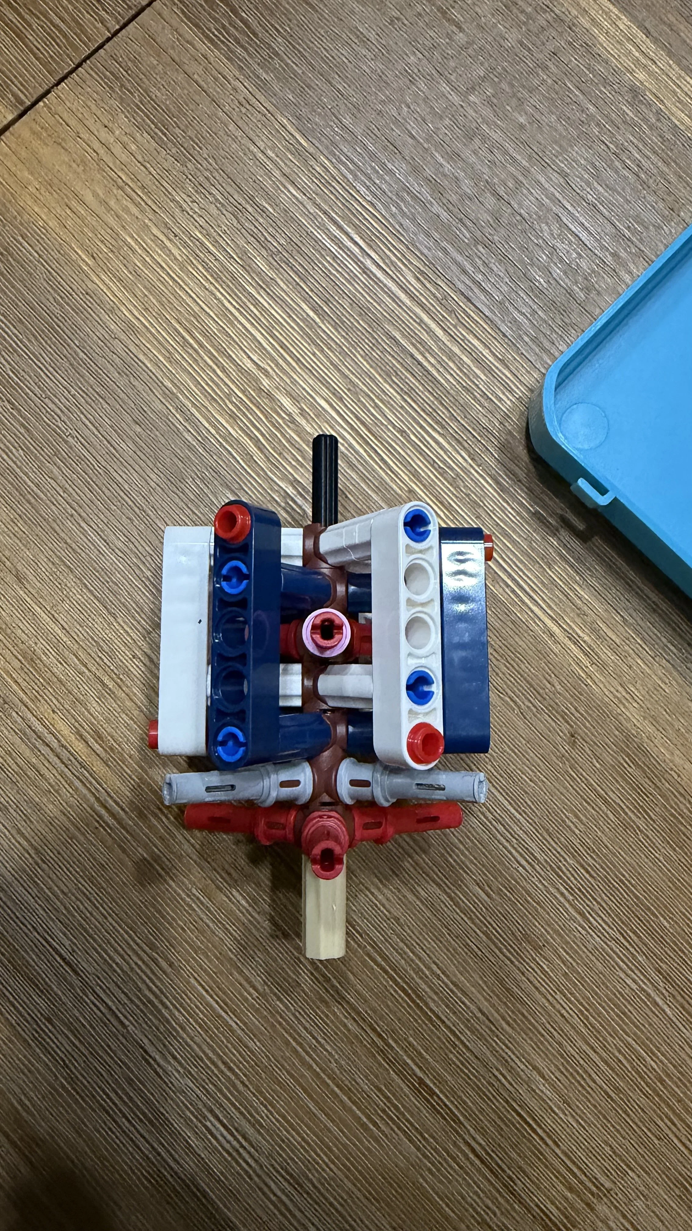 Overhead view of Technic assemblies inside LEGO Tintin Moon Rocket during Bag 3
