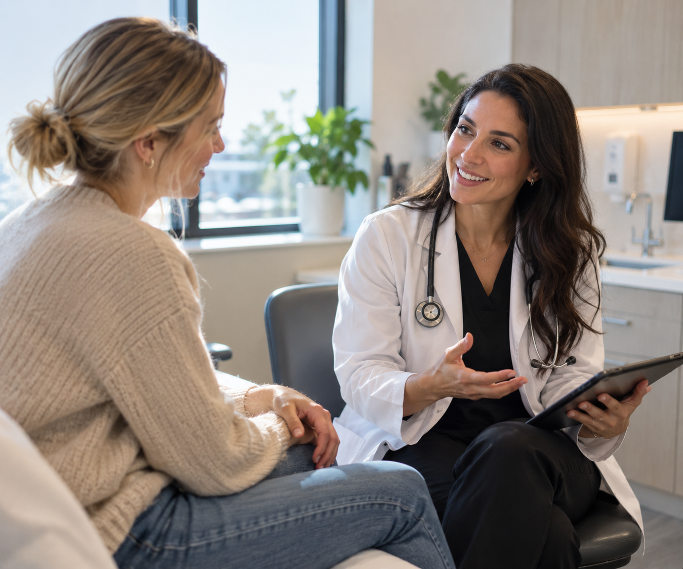 A doctor talking to a woman in a medical office