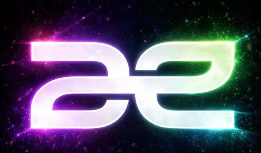 Digital 2022 logo with glowing neon style numbers 2 and 2 against a dark, colorful background.