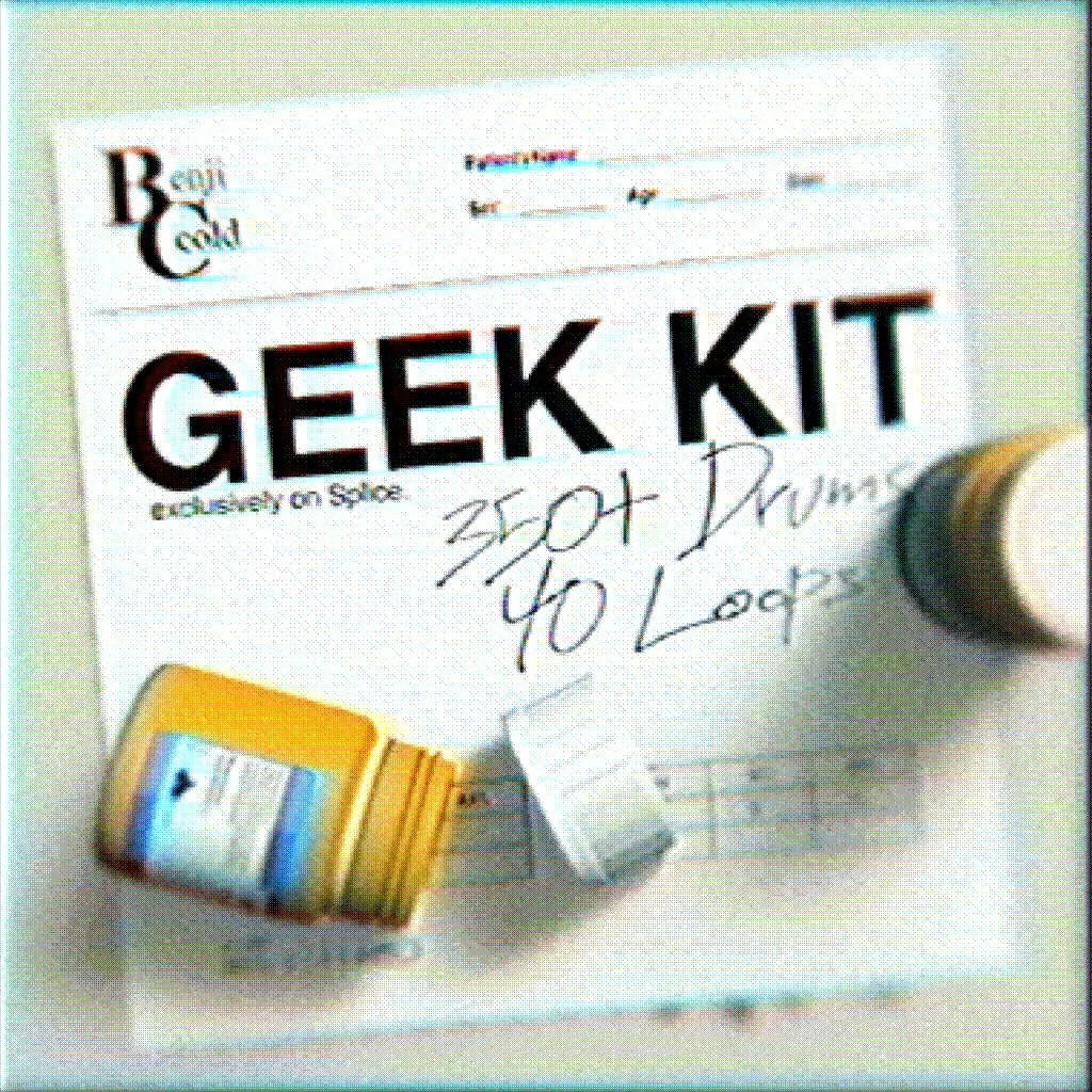 A black shiny pillow or stuffed toy shaped like a person lying on a pink fuzzy blanket.