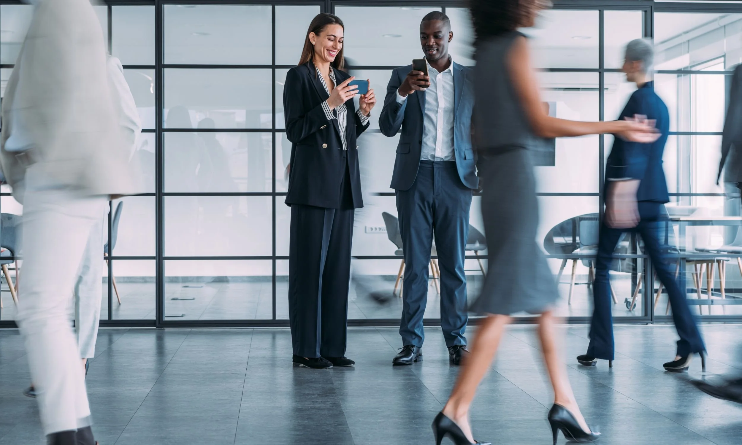 Image shows executives in busy office