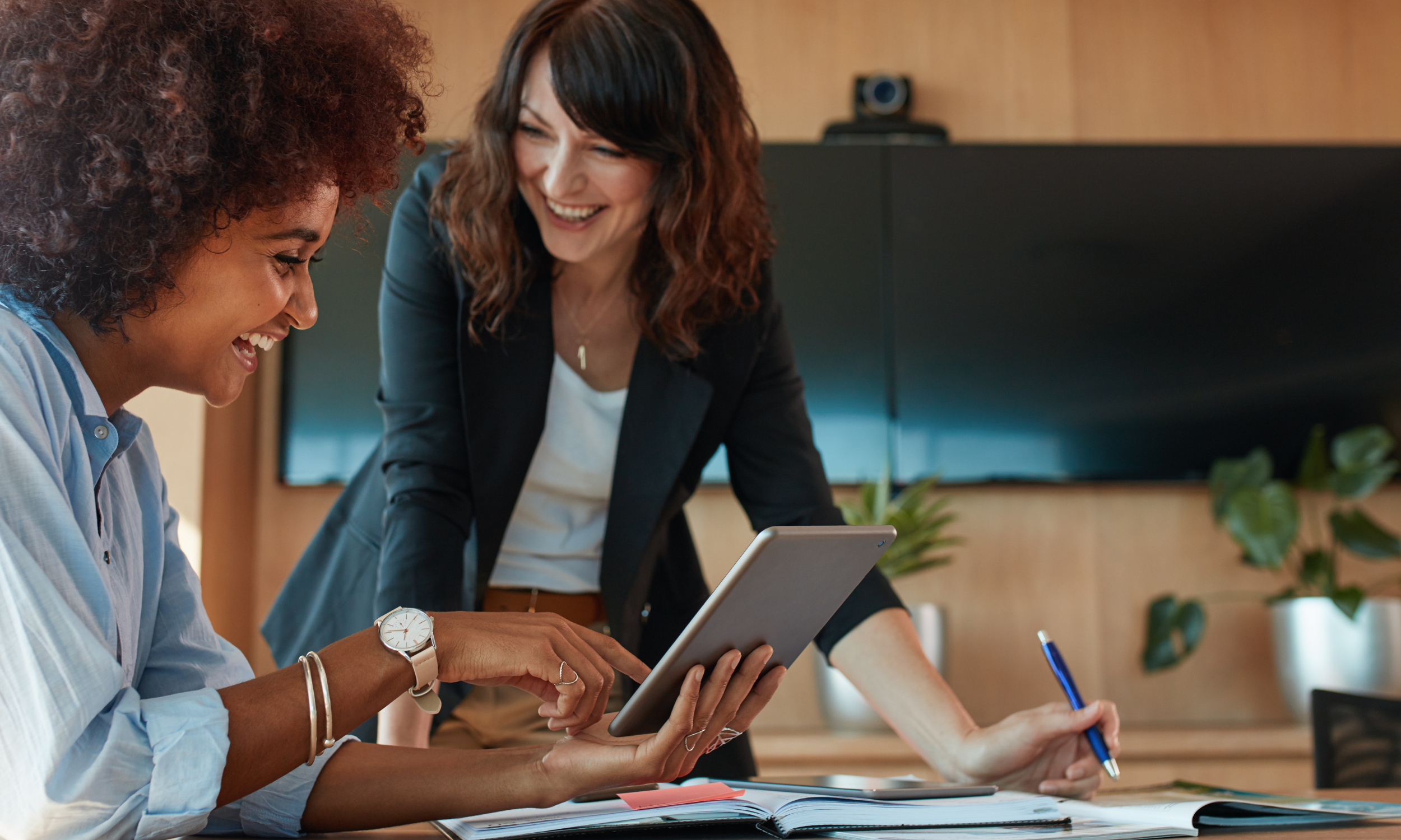 Shows two entrepreneurs at work