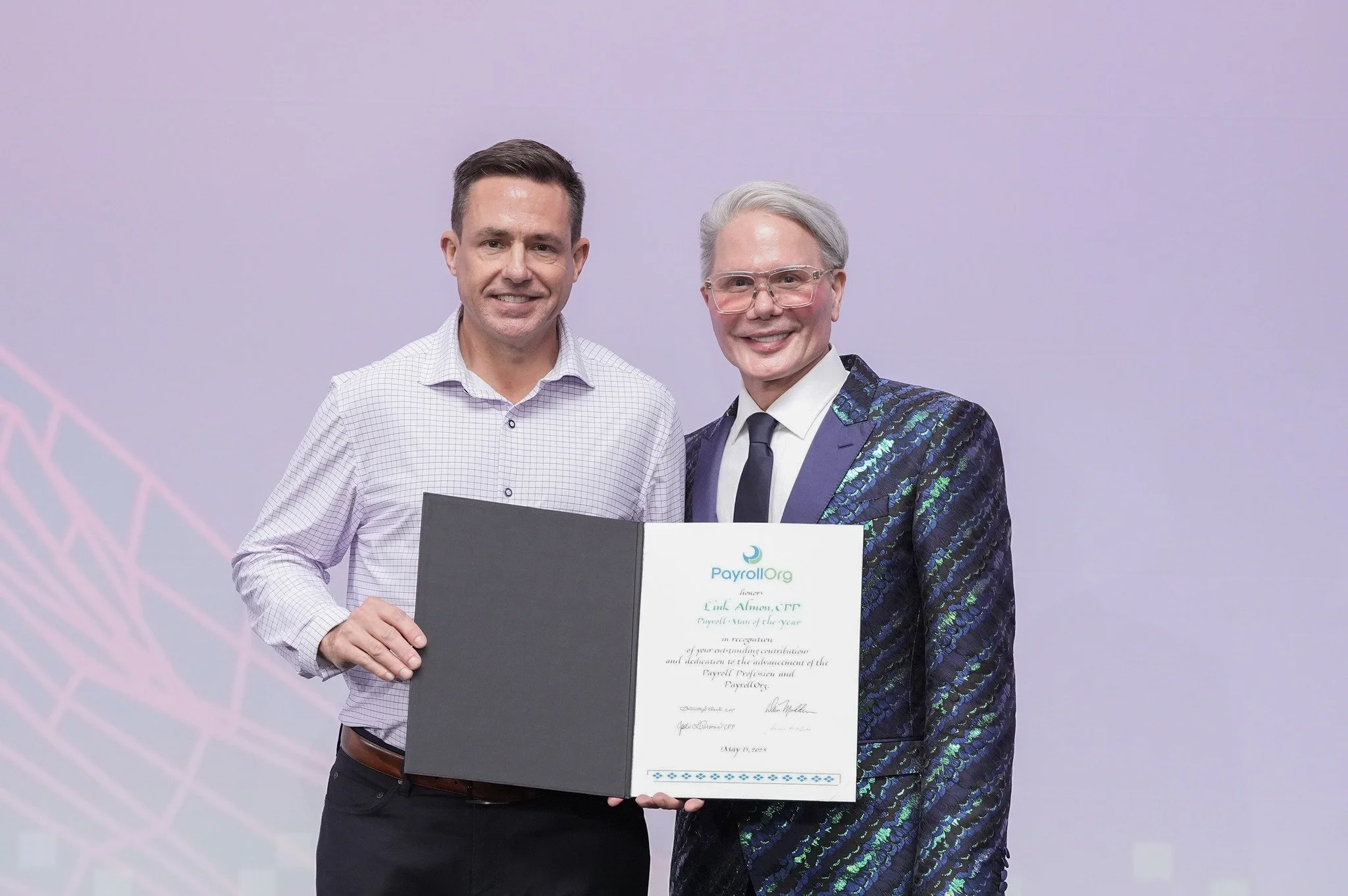 Link Altom posing with his award.