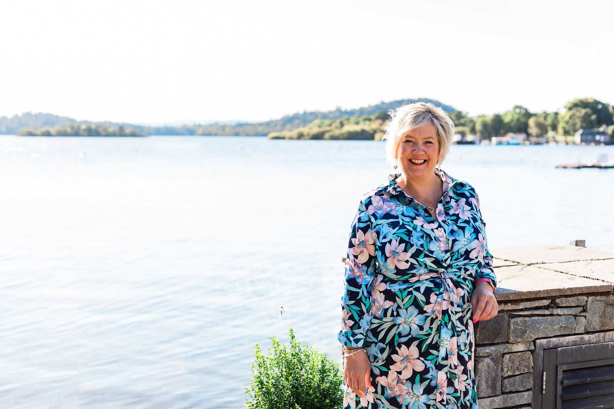 An image of Niki, the Trailblazing Females Founder, smiling at the seafront.