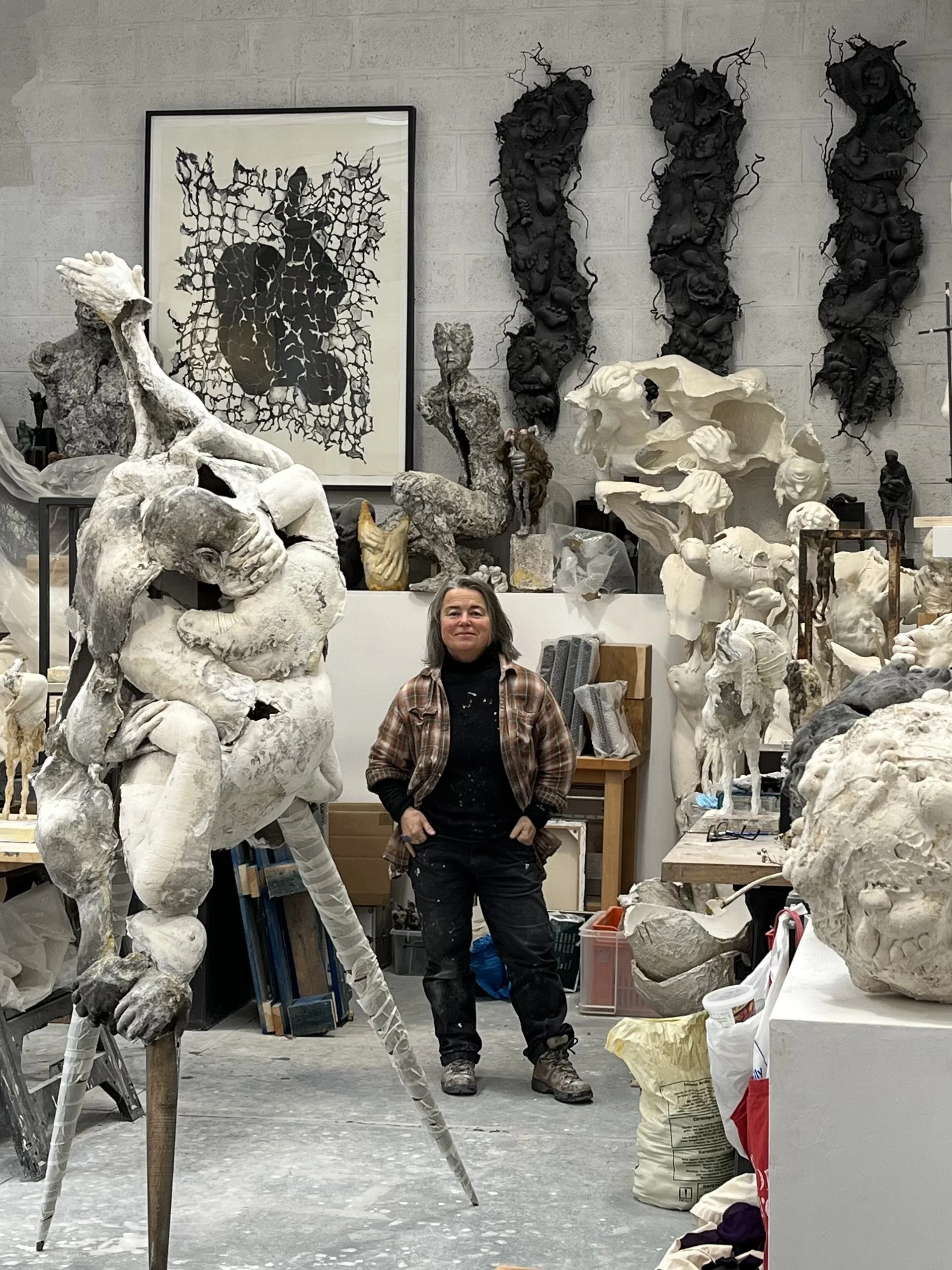 Anna with examples of work in her studiio