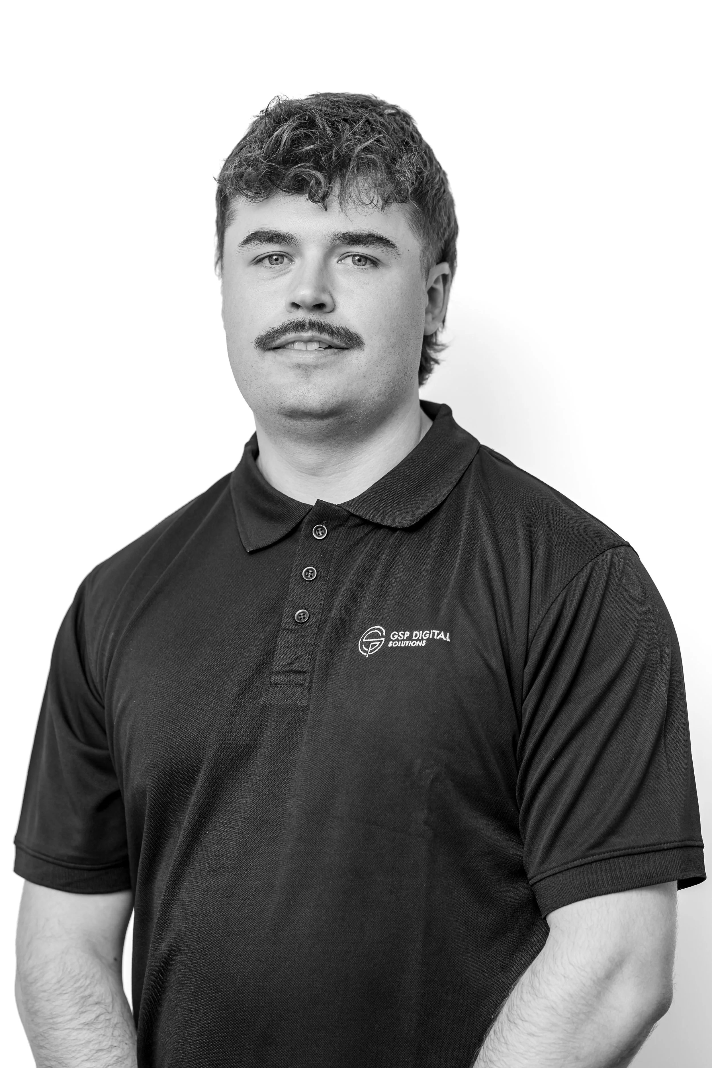 GSP Digital Solutions team member wearing branded hoodie in portrait photo.
