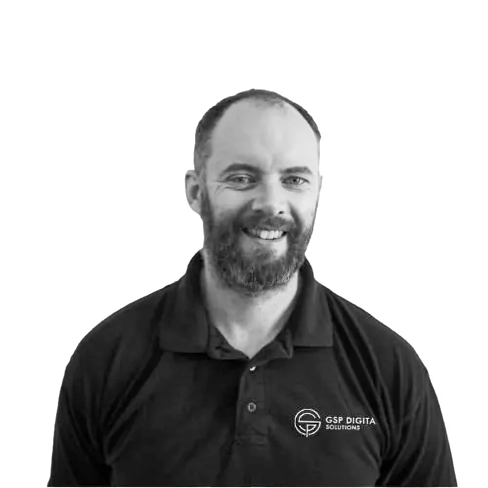 Team member at GSP Digital Solutions smiling in a black and white portrait.