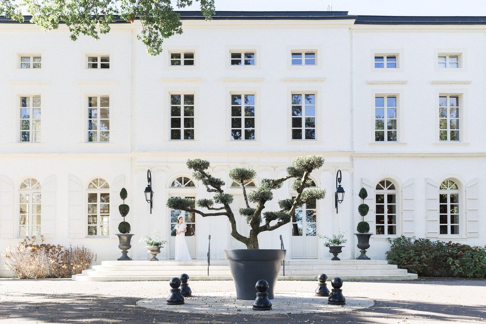 Elegant outdoor ceremony and reception at Château Longpré in the South West of France with gardens and stone terraces