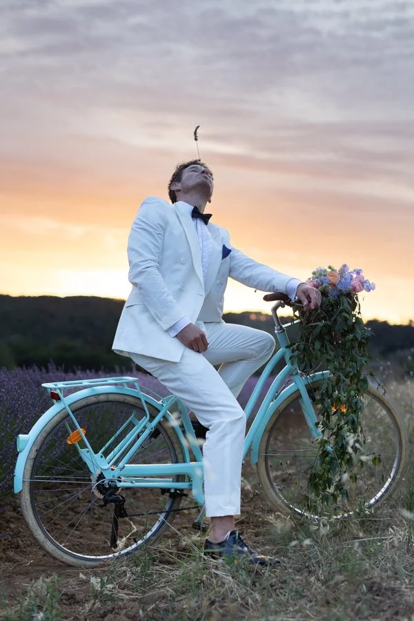 groom in the lavender fields at sunset