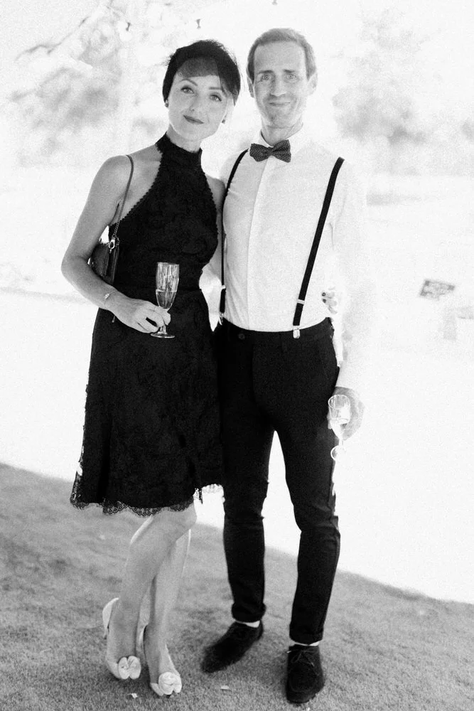 Elegant wedding guests during cocktail hour at château in South West France