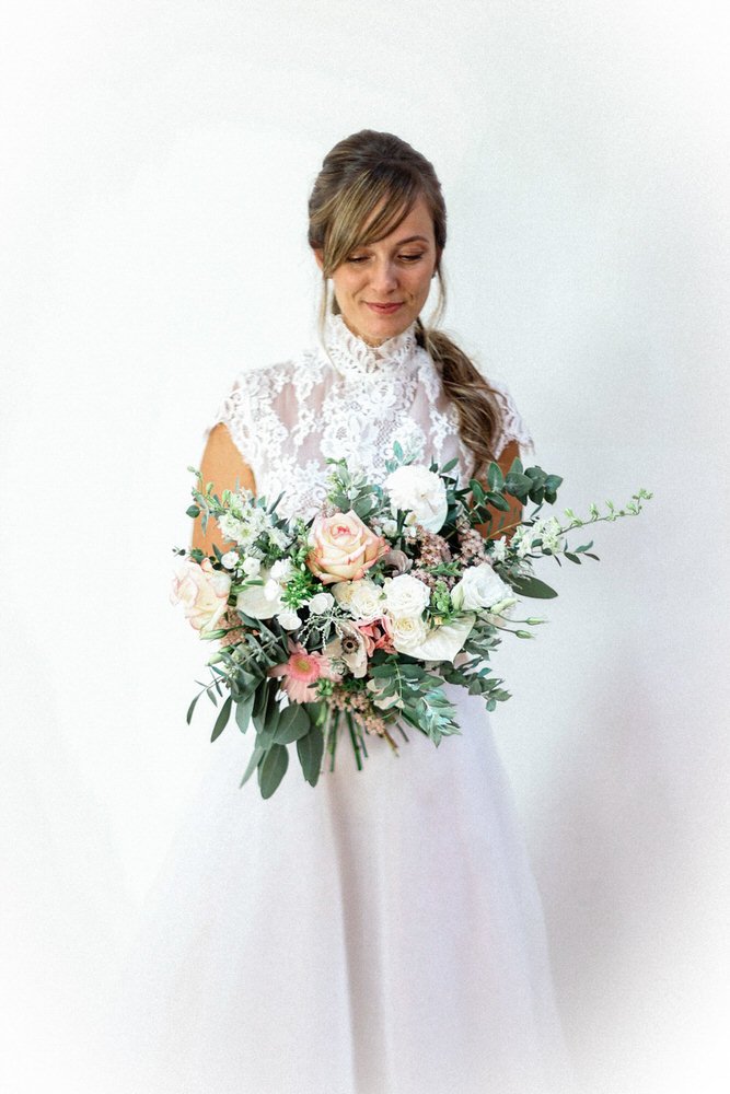 Bride portrait holding bouquet at Château de la Baronnie wedding in France