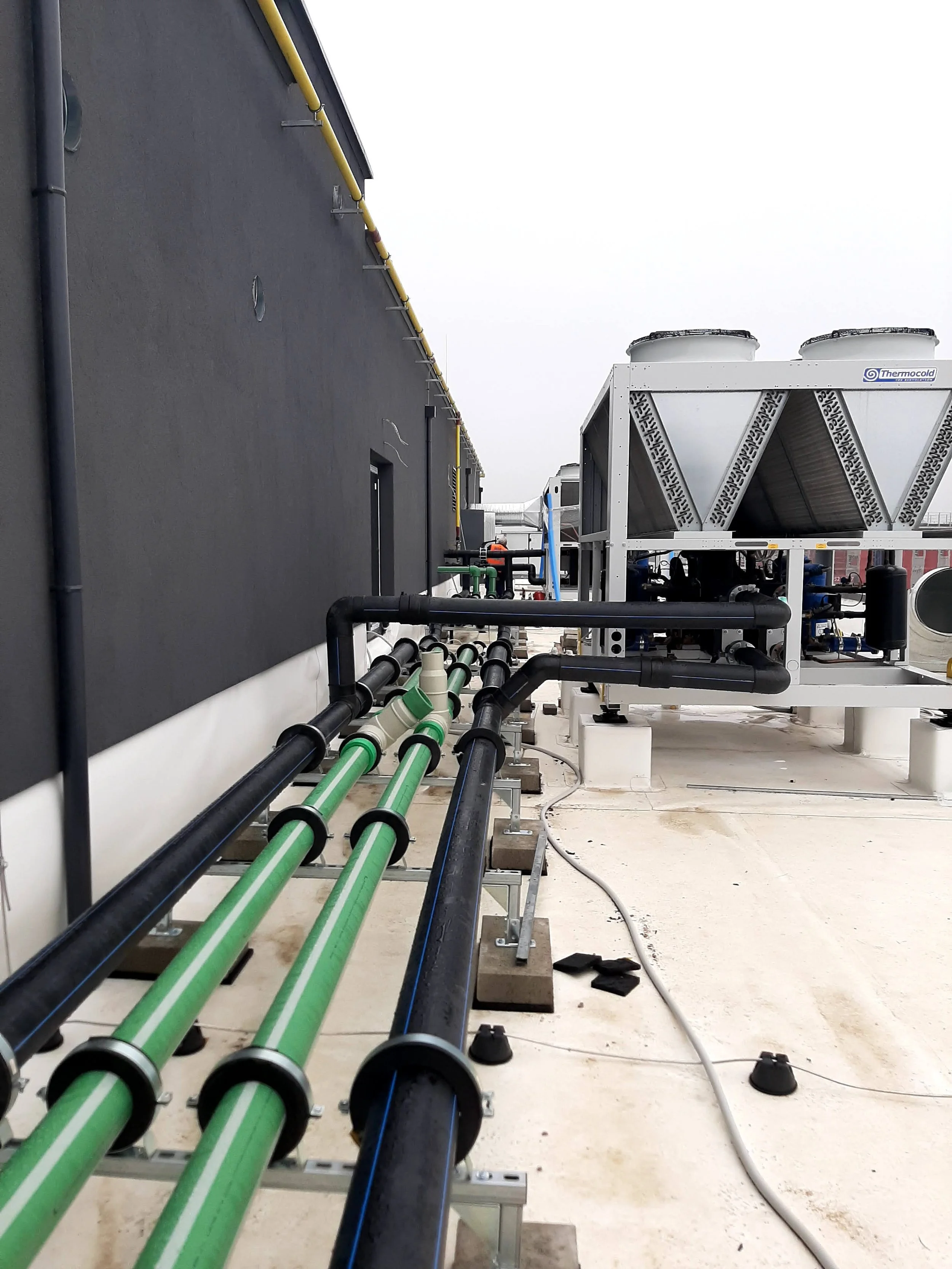 Water pipes and HVAC equipment on a rooftop