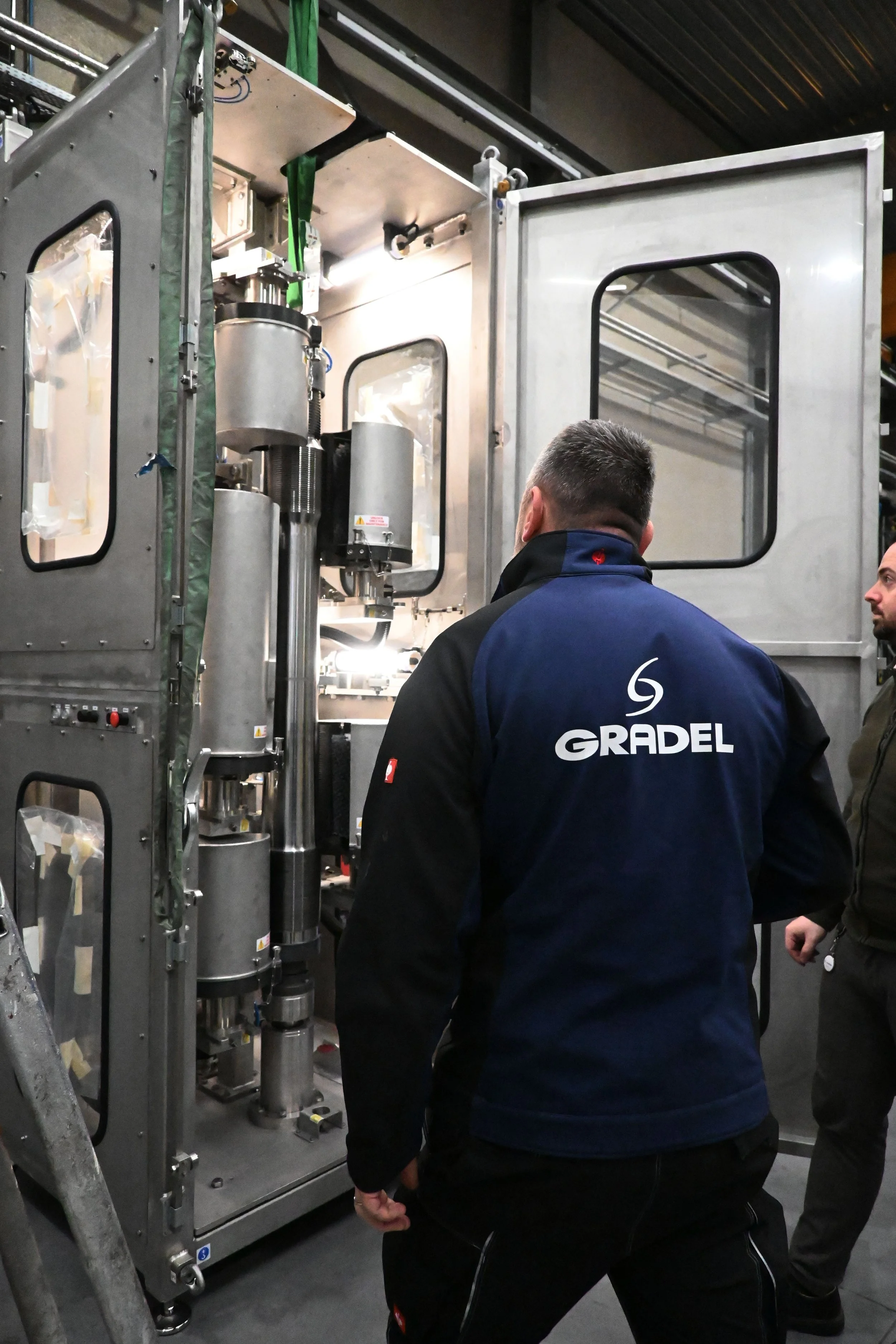 technician observing mechanical machine.jpg