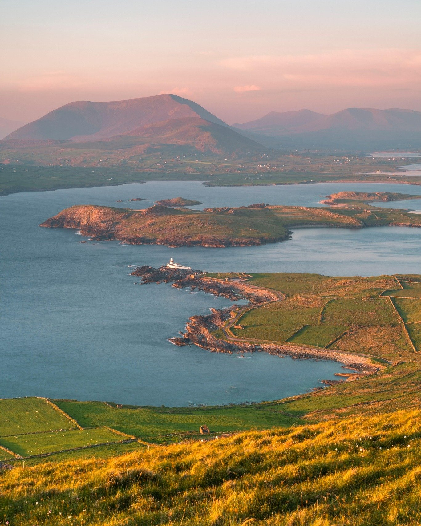 Evening settles over Valentia Island ☀️

From the top of Geokaun Mountain you can see it all, the lighthouse down below, the Skellig Coast stretching out, and the last of the light warming the fields and hills.

One of those views that makes you stop
