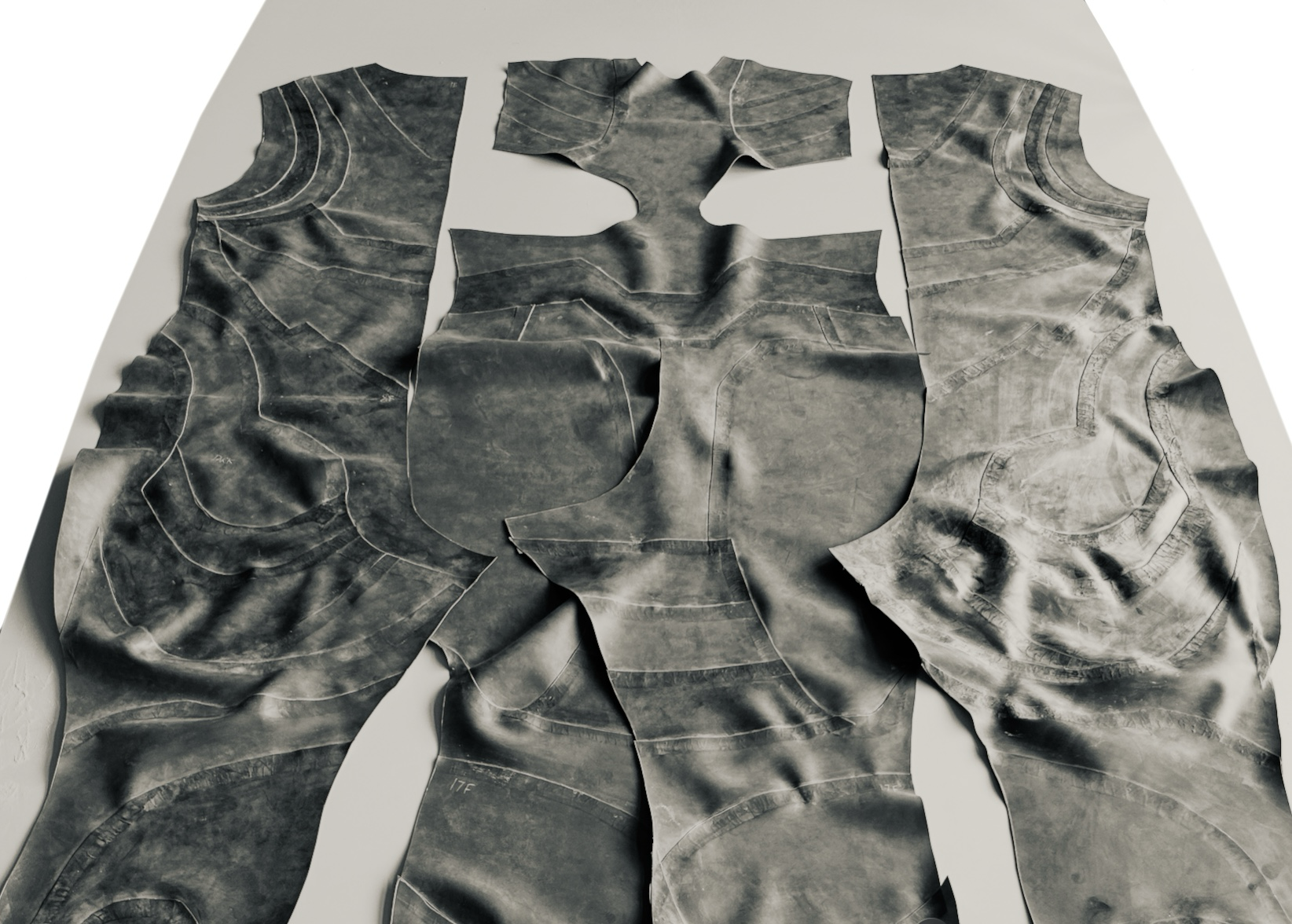 Pieces of shredded denim fabric arranged to resemble a human figure.