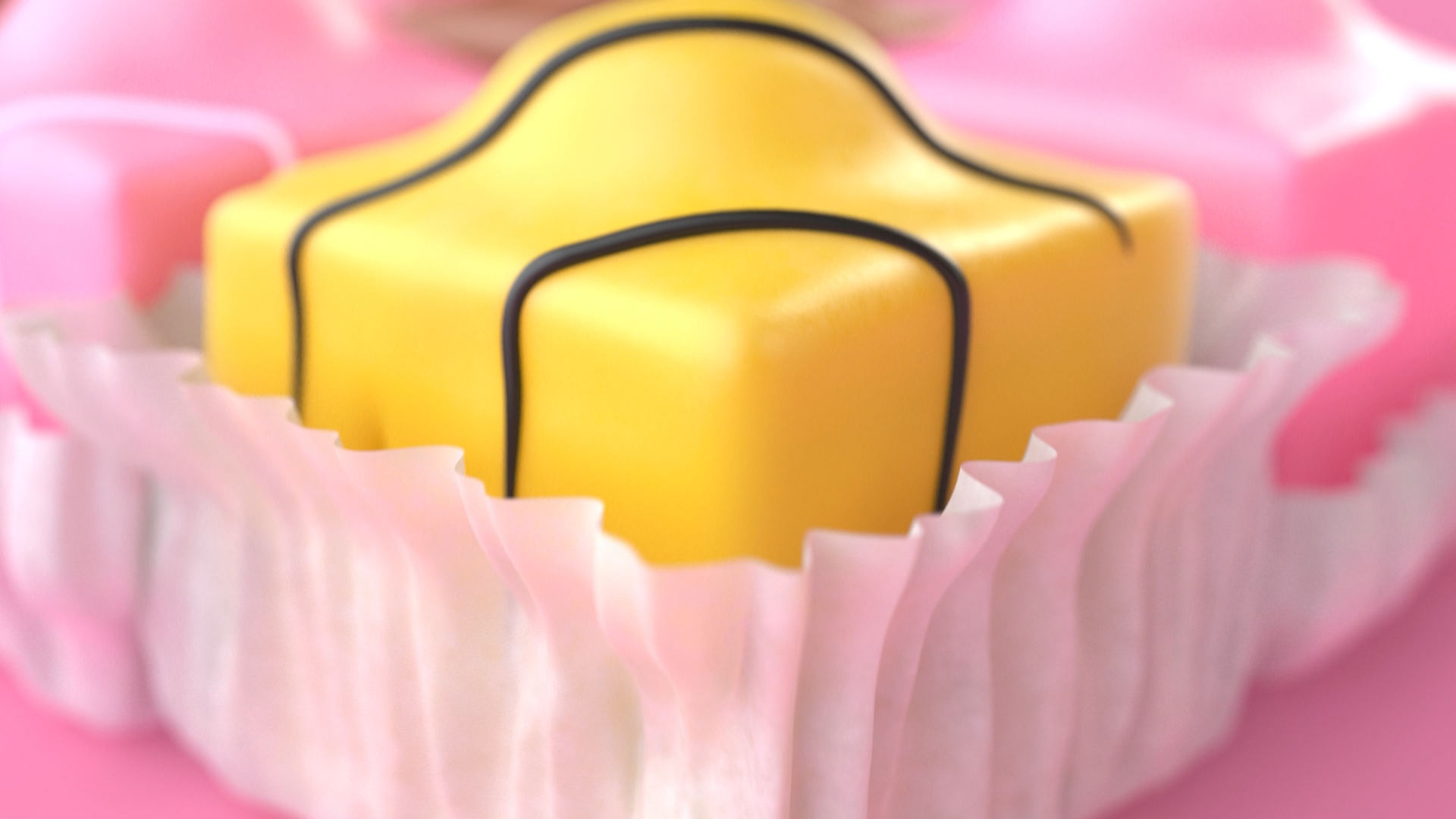 Close-up of a yellow gift box with black lines on a pink cupcake liner, surrounded by pink paper cupcake wrappers.