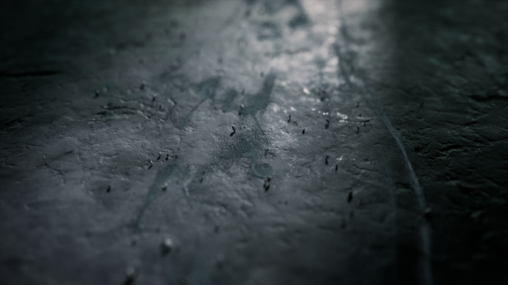 Close-up of a foggy window with a handprint in the condensation.