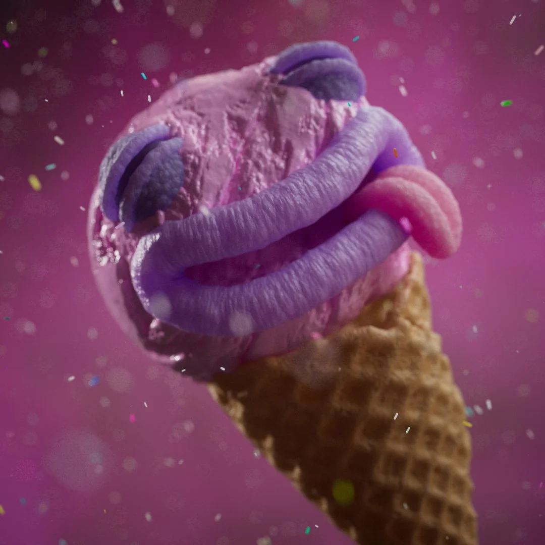 A scoop of ice cream topped with pink and purple worms in a cone with a pink background and confetti.