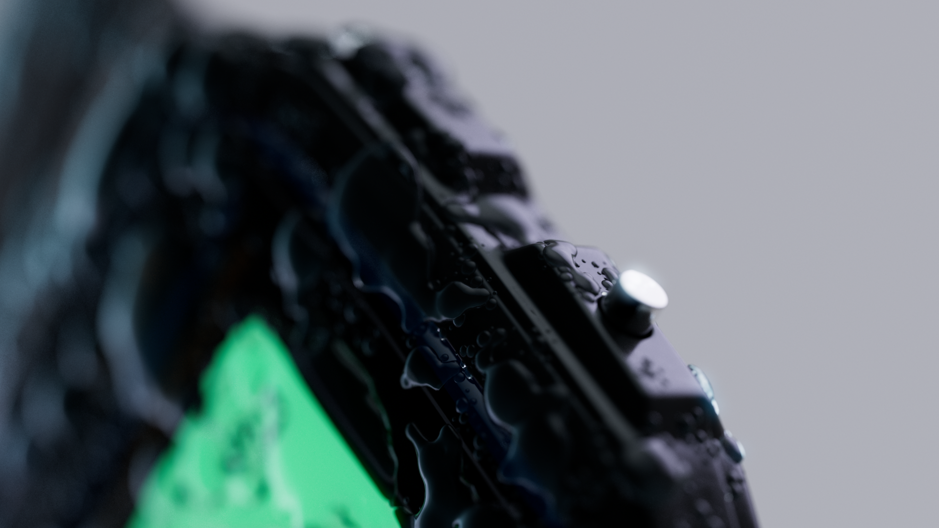 Close-up of a wet fitness tracker or smartwatch with droplets of water on it.