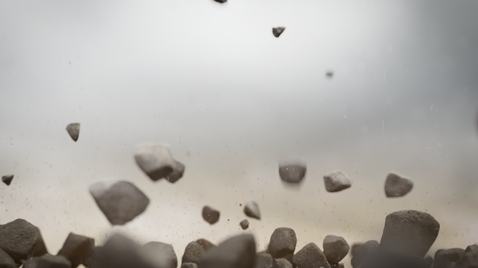 Rocks or debris suspended in the air against a cloudy sky background.