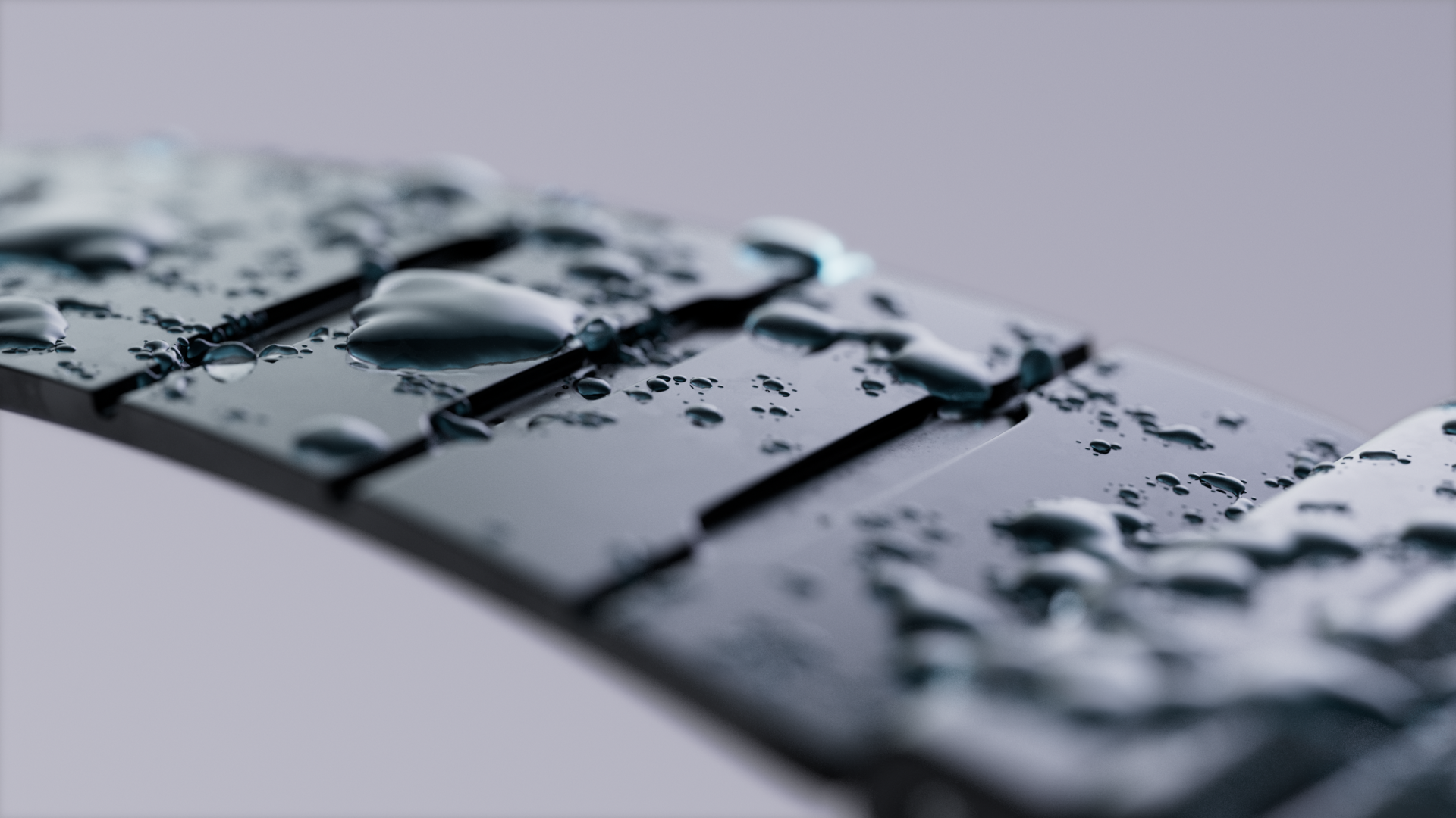 Close-up of a keyboard with water droplets on the keys.