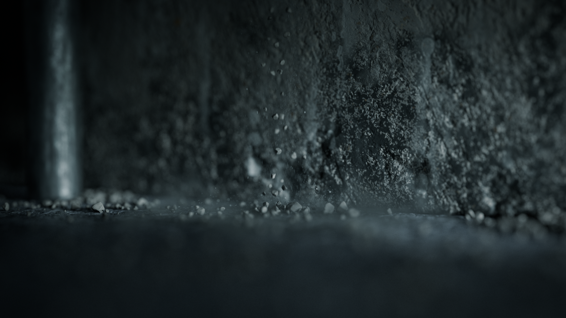 Close-up of a saw cutting through black material, with dust and small debris flying.
