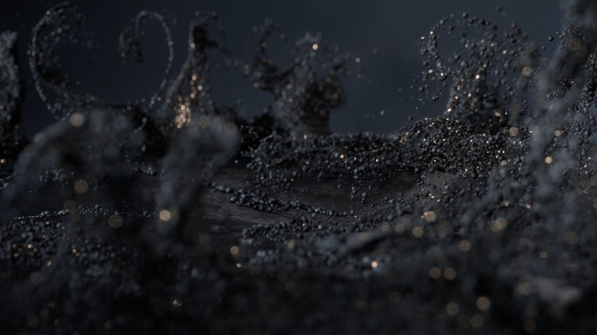 Close-up of black sand with tiny reflective particles, creating a textured surface with sparkling highlights.