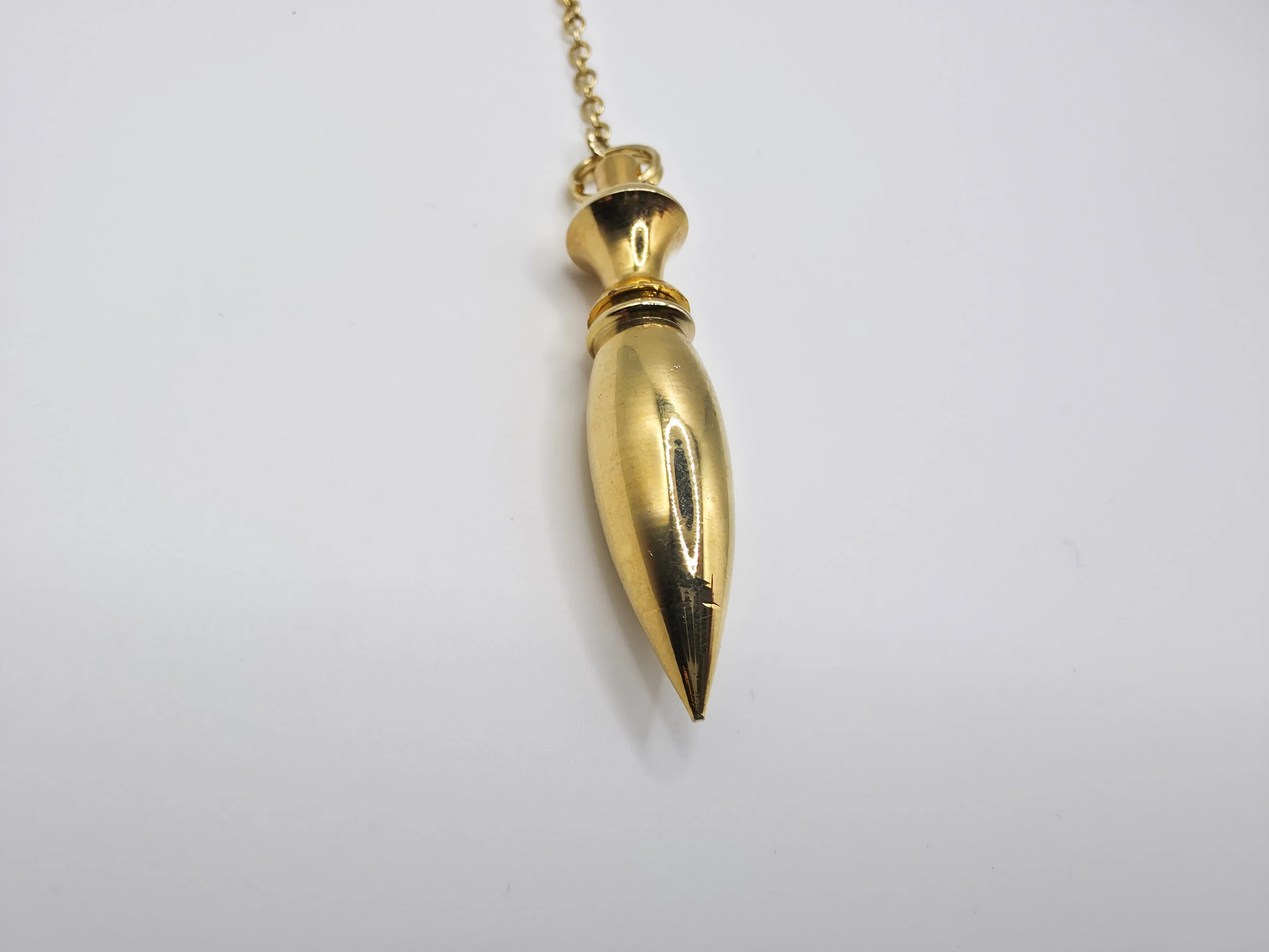 Brass arrow pendulum
