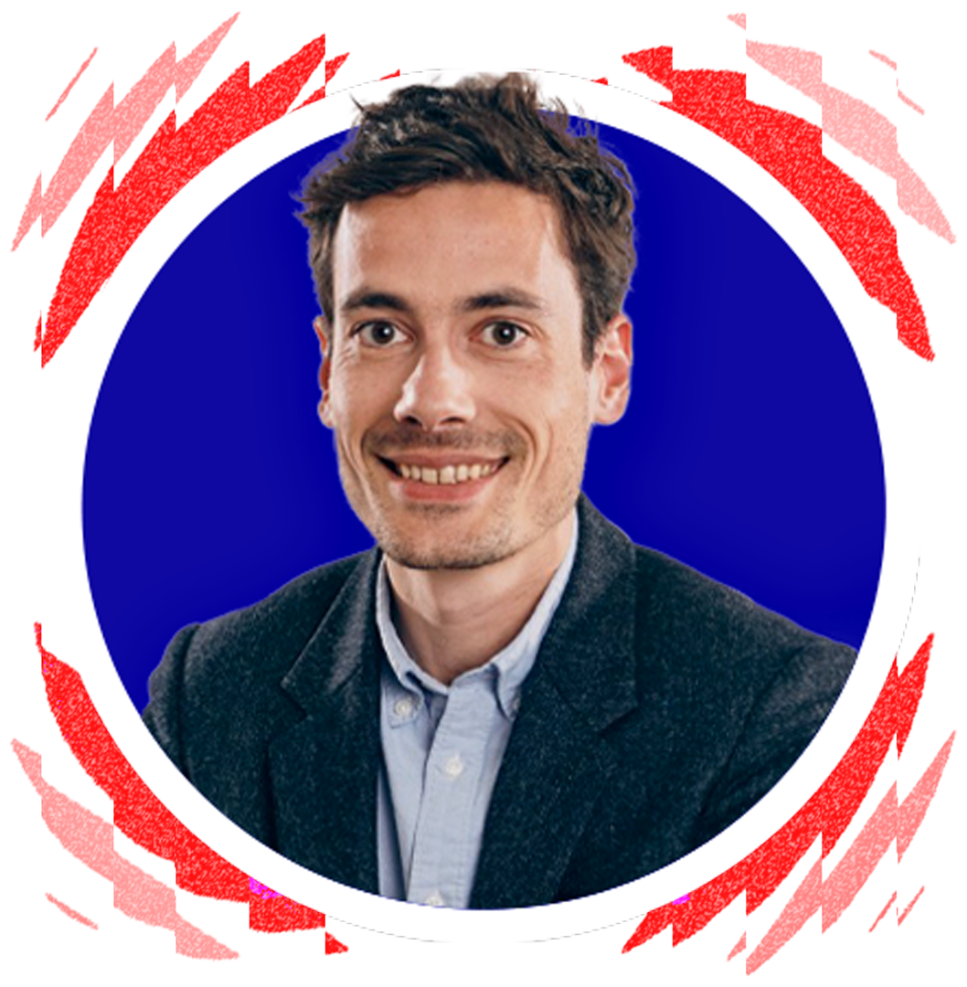 A smiling man in a suit, professional portrait, blue background surrounded by a white circle and a red background.