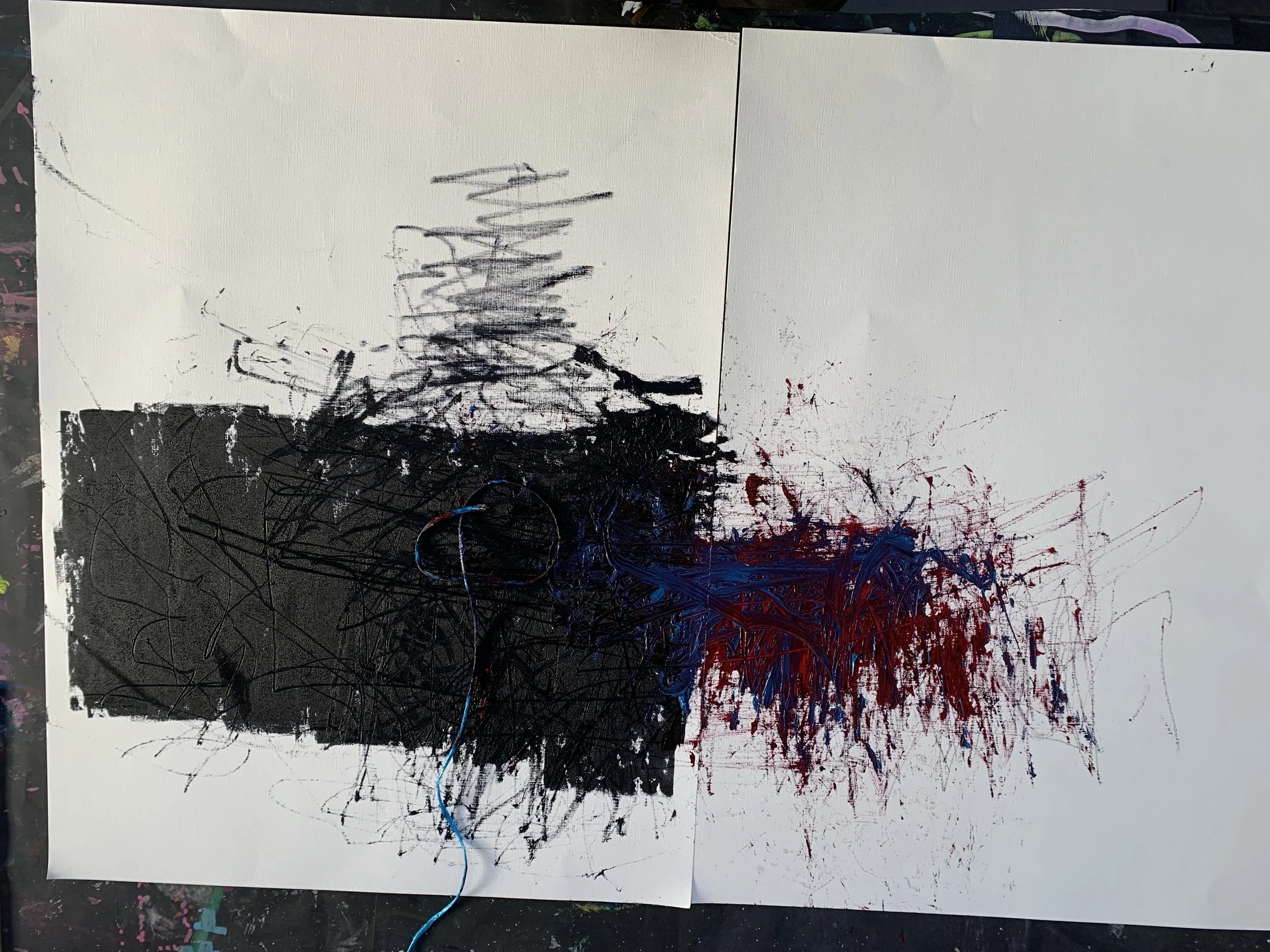 Abstract artwork with black, red, and blue splatters and lines on a white canvas, divided into three sections with different painting styles.
