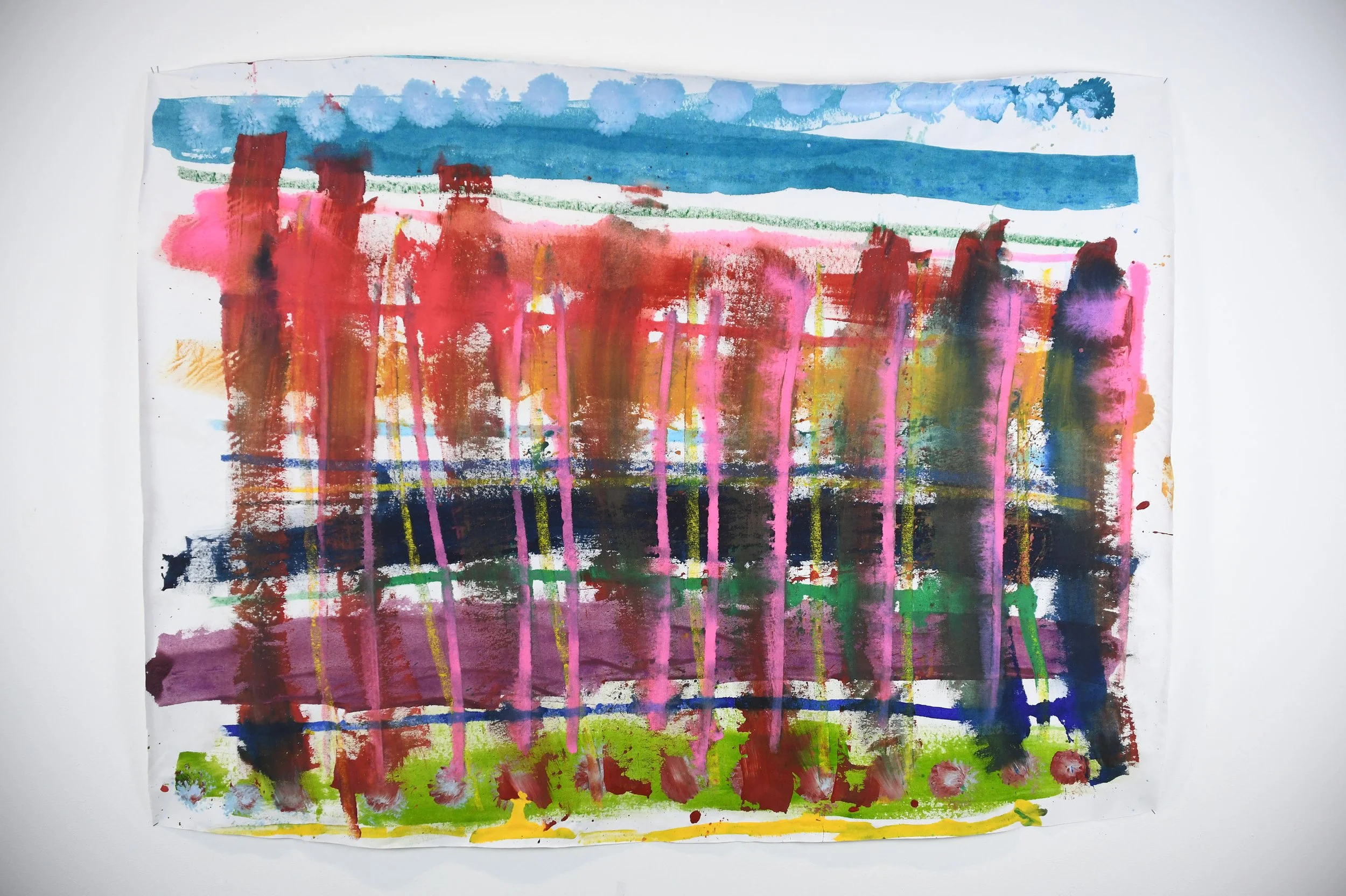 Abstract watercolor painting with horizontal blue, red, pink, purple, green, and yellow streaks and splashes on white paper.