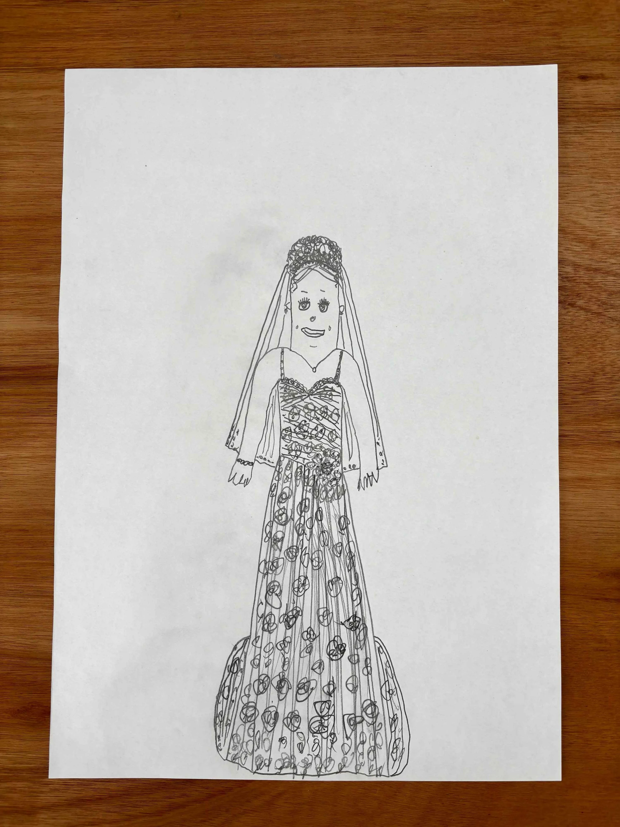 Line drawing of a woman in a gown with a detailed, floral pattern, wearing a tiara or crown, and smiling.
